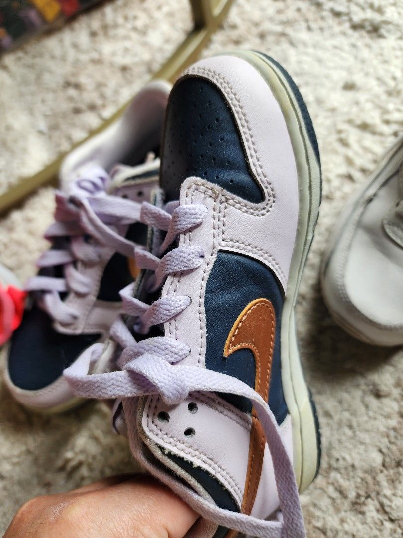 Nike Dunk Low Kids Shoes (Category: Babies & Kids Fashion) located in Pasig City. Submitted by closetspaced (Listing ID 1417839526, Image 2). Description: - Nike Dunk Low toddler shoes - Size: US 12C - Colorway: Lilac, Navy, Orange - Features: Leather upper, rubber sole, lilac laces, navy swoosh - Condition: Good - Inner tag visible.