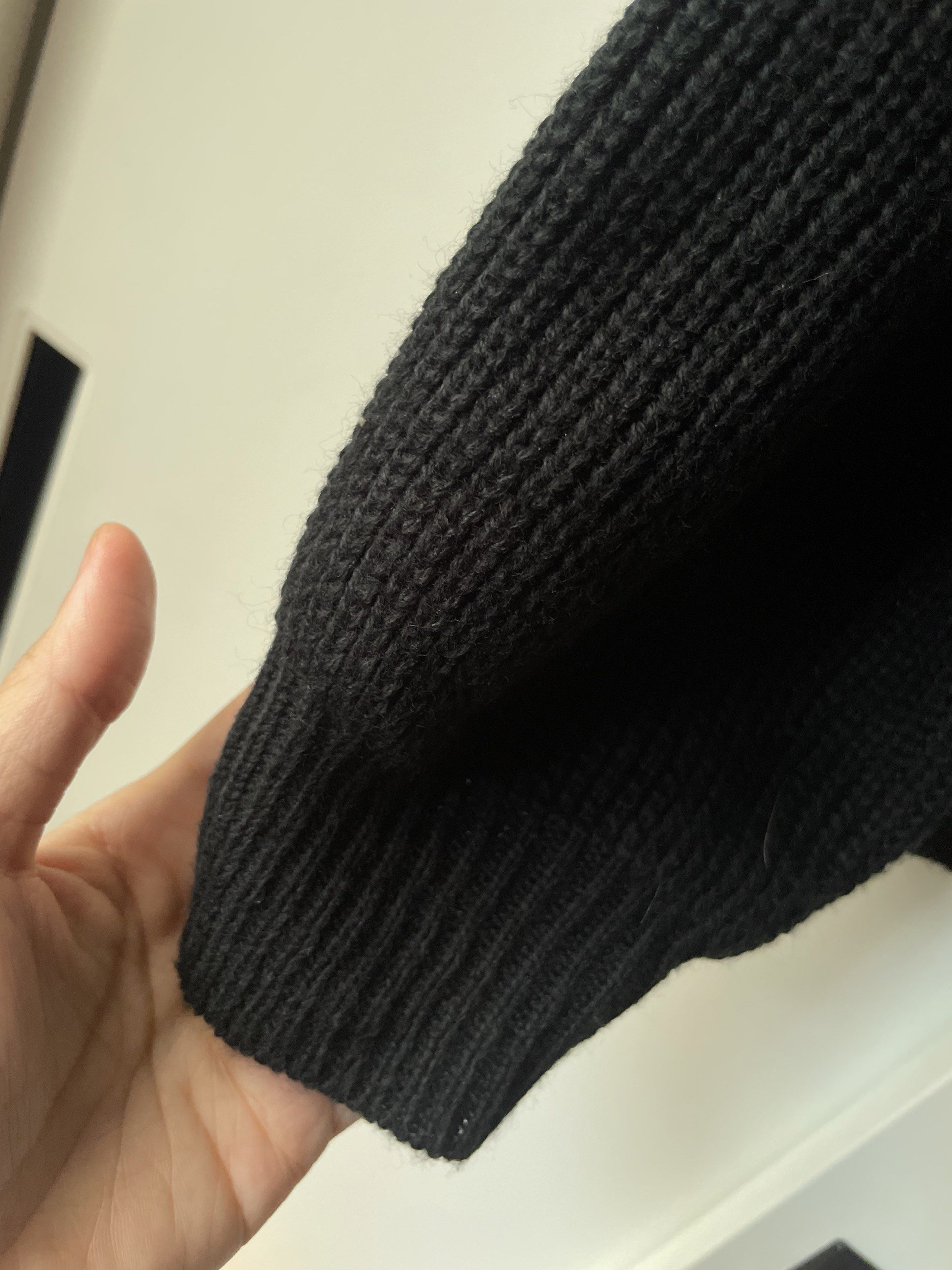 Off shoulder asymmetrical Black Knit Sweater (Category: Coats, Jackets and Outerwear) located in Manila. Submitted by chenpots (Listing ID 1417897114, Image 2). Description: - Off-shoulder design - Black knit sweater - Size: S - Condition: Good - Comfortable knit material - Perfect for casual wear.