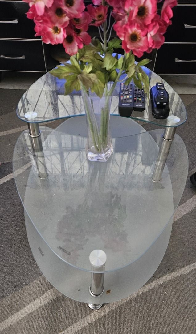OVAL GLASS CENTER TABLE for Rush Sale (Category: Tables & Sets) located in Marikina City. Submitted by queenbelle28 (Listing ID 1417838466, Image 2). Description: - Stylish oval coffee table - Two-tiered glass design - Chrome legs - Modern aesthetic - Easy to clean glass surfaces - Sturdy and stable - Perfect for living rooms.