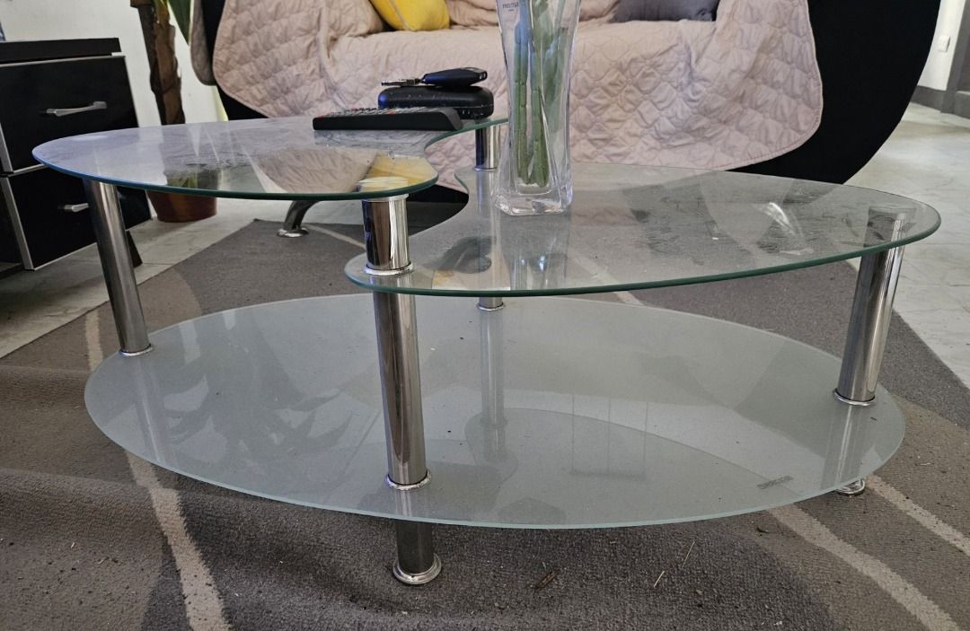 OVAL GLASS CENTER TABLE for Rush Sale (Category: Tables & Sets) located in Marikina City. Submitted by queenbelle28 (Listing ID 1417838466, Image 1). Description: - Stylish oval coffee table - Two-tiered glass design - Chrome legs - Modern aesthetic - Easy to clean glass surfaces - Sturdy and stable - Perfect for living rooms.