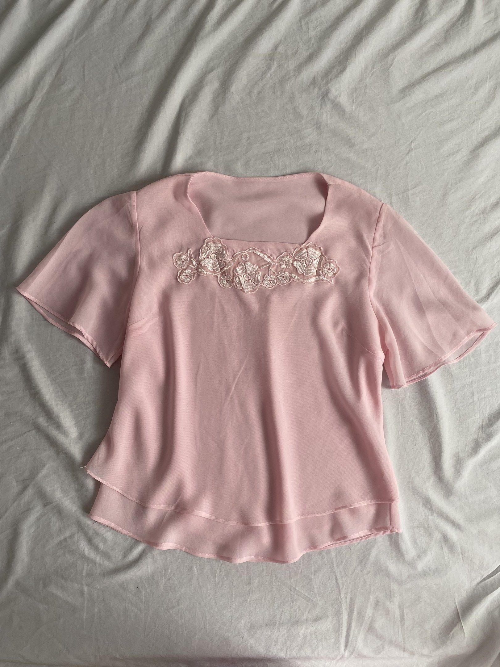 Pink Blouse with Lace Detail (Category: Blouses) located in Manila. Submitted by chocoxlb__ (Listing ID 1417850162, Image 1). Description: - Pink blouse - Square neckline - Short, flared sleeves - Lace detail at neckline - Layered hem - Lightweight fabric - Can fit up to M size.