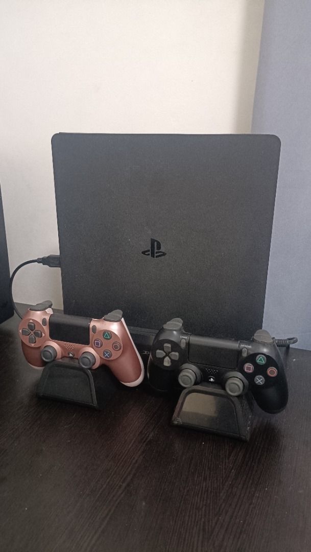 PlayStation 4 Slim Console with Two Controllers (Category: PlayStation) located in San Mateo. Submitted by yoisho (Listing ID 1417922750, Image 1). Description: PlayStation 4 Slim 500gb console (black) Games: Days Gone Monster Hunter: World - Includes two controllers: - One black controller - One rose gold controller - Dobe Ps4 Slim Stand Pickup or Meetup Issue: may ghost click sa PS button ng controller Prefer Pickup para ma test! .
