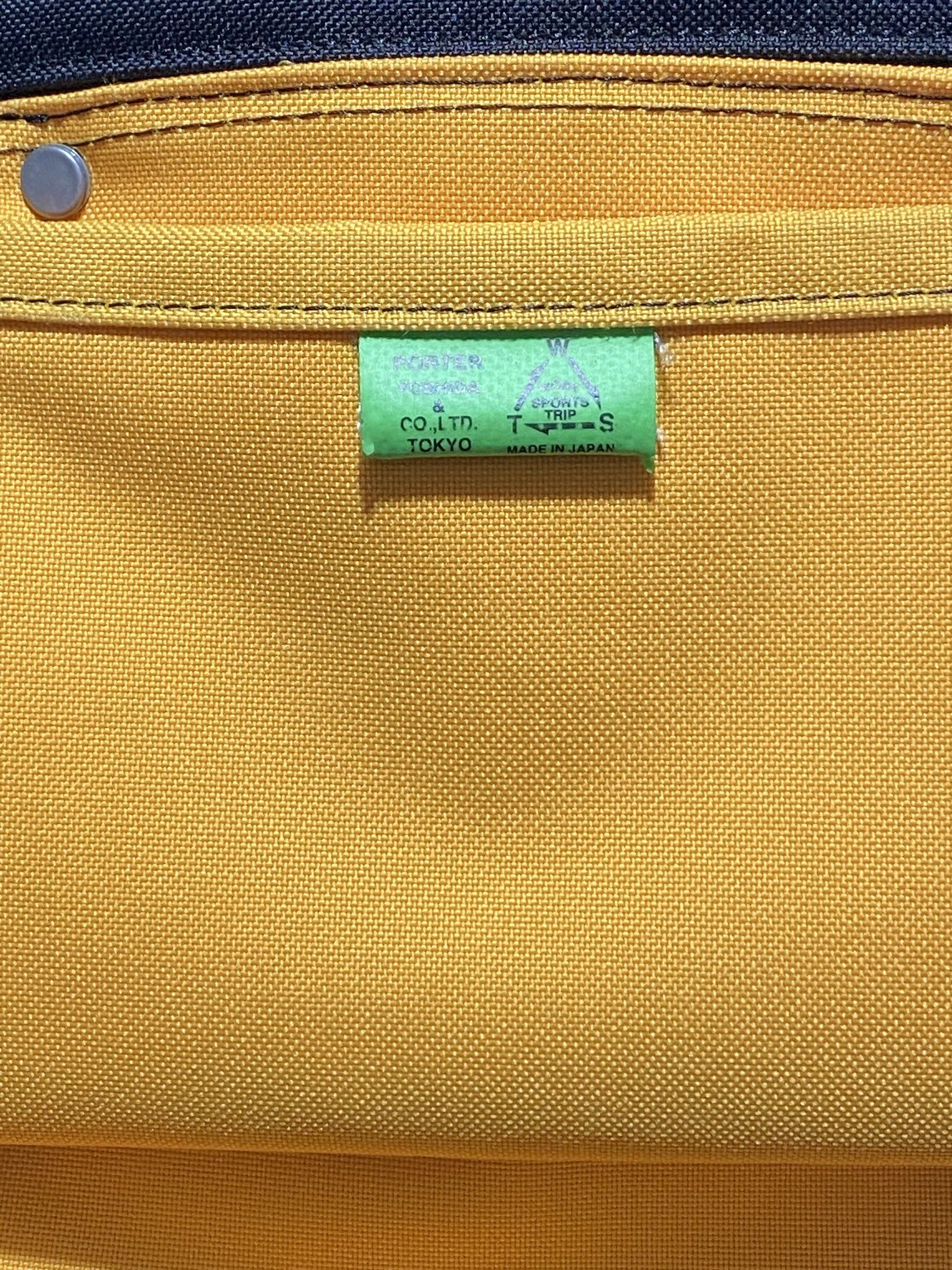 Porter Yoshida & Co. Tokyo Backpack (Category: Backpacks) located in Cagayan de Oro. Submitted by cu_2022 (Listing ID 1417992634, Image 3). Description: - Brand: Porter Yoshida & Co. Tokyo(AUTHENTIC) - Made in Japan - Color: Black and Yellow - Features: - Multiple compartments - Front zipper pocket - Snap closure pocket - Adjustable shoulder straps - Top handle .