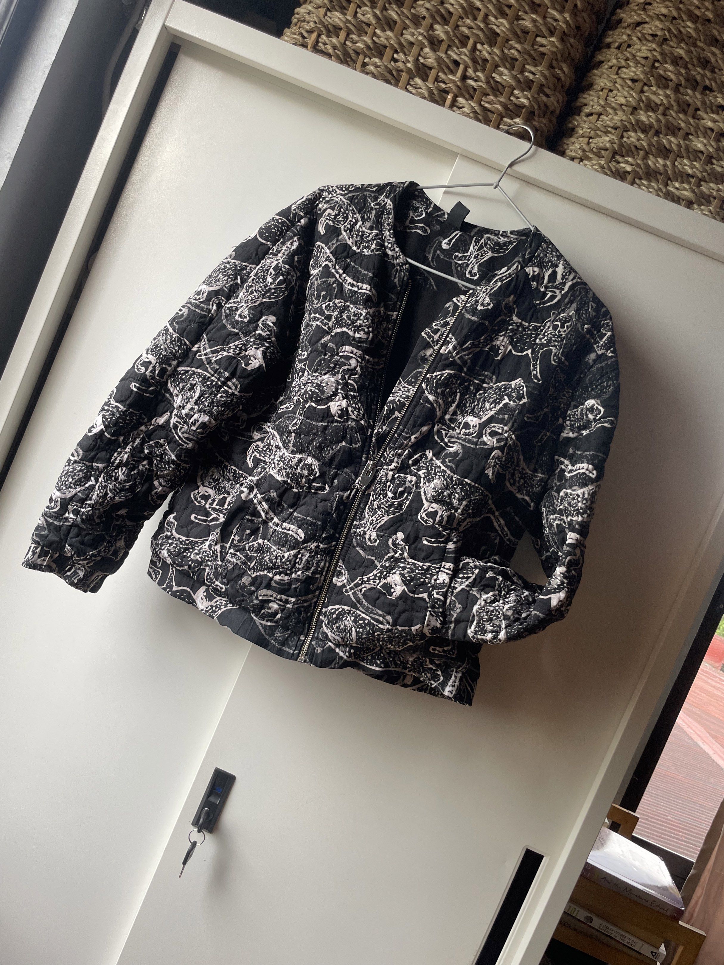 Quilted Black and White Tiger Jacket (Category: Coats, Jackets and Outerwear) located in Manila. Submitted by chenpots (Listing ID 1417896627, Image 1). Description: Stylish quilted jacket featuring a unique black and white animal print. It has a full zipper closure and a round neckline. The jacket has long sleeves and a comfortable fit. Perfect for adding a touch of flair to any outfit. A versatile piece that can be dressed up or down..