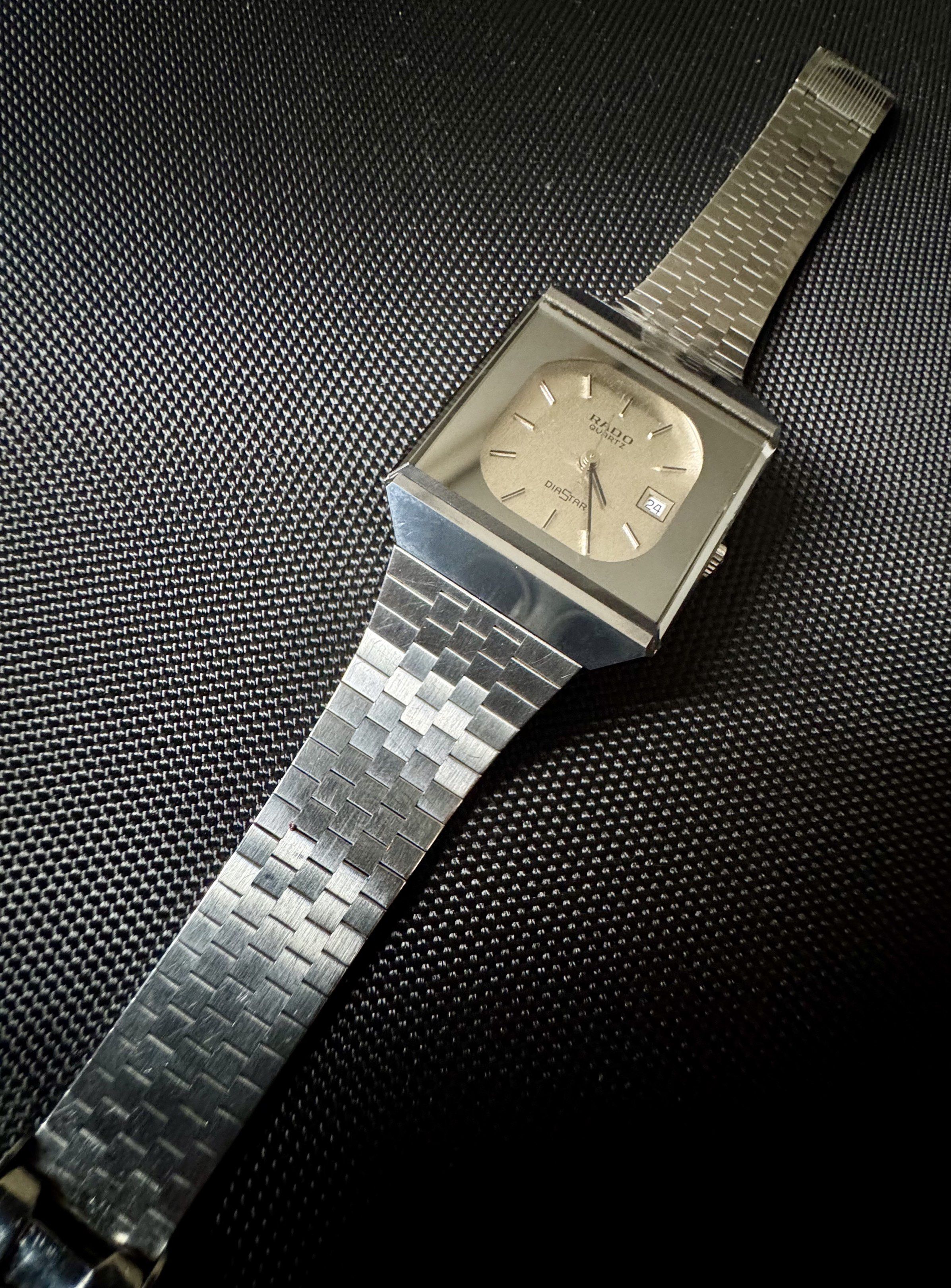 Rado DiaStar Quartz Watch (Category: Luxury Watches) located in Cavite. Submitted by ofanatix (Listing ID 1417926937, Image 1). Description: - Vintage Rado DiaStar Quartz Watch - Silver-toned square dial - Date display feature - Stainless steel bracelet - Folding clasp - Classic design - Unique bracelet pattern - Rado logo and model information on case back.
