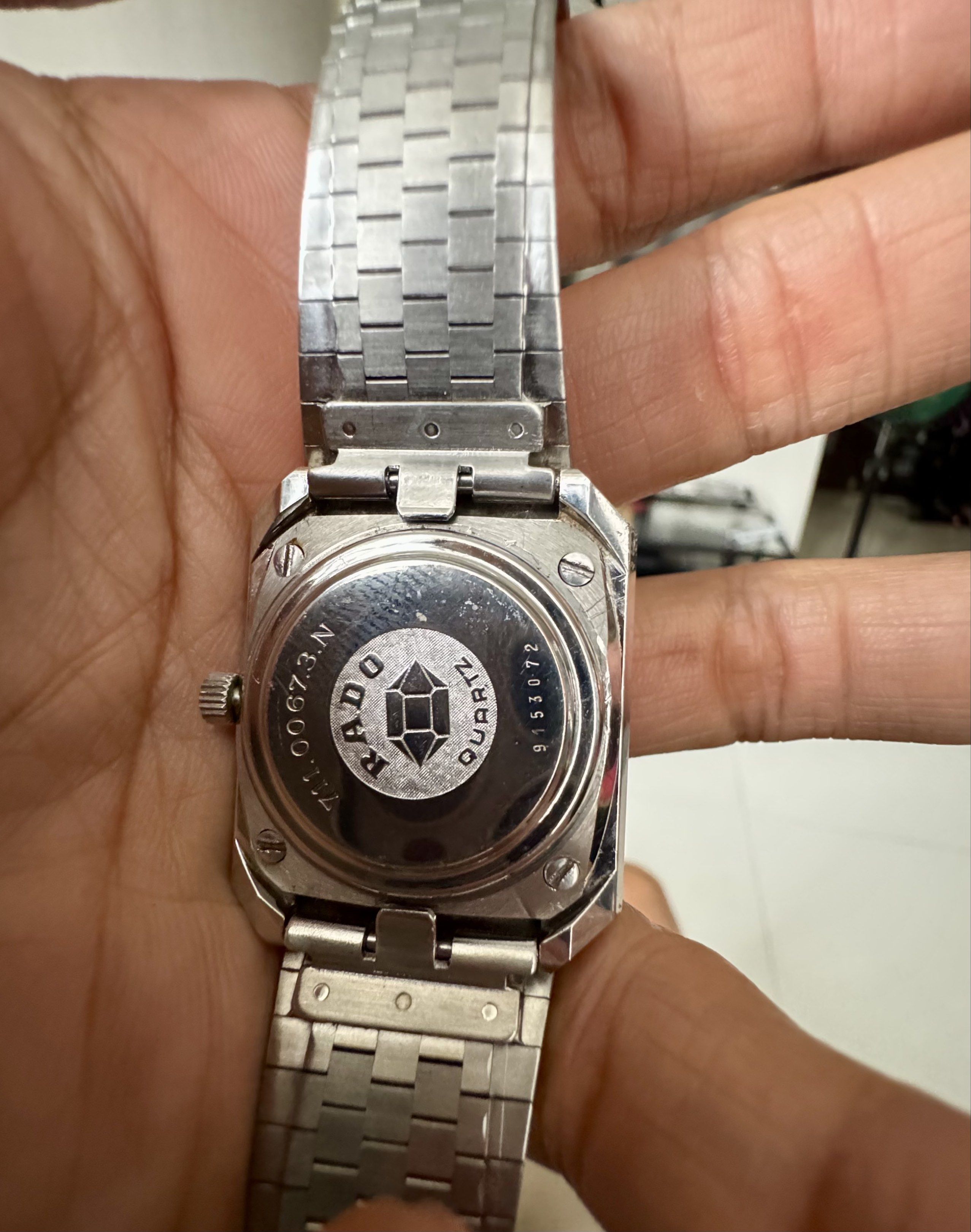 Rado DiaStar Quartz Watch (Category: Luxury Watches) located in Cavite. Submitted by ofanatix (Listing ID 1417926937, Image 2). Description: - Vintage Rado DiaStar Quartz Watch - Silver-toned square dial - Date display feature - Stainless steel bracelet - Folding clasp - Classic design - Unique bracelet pattern - Rado logo and model information on case back.