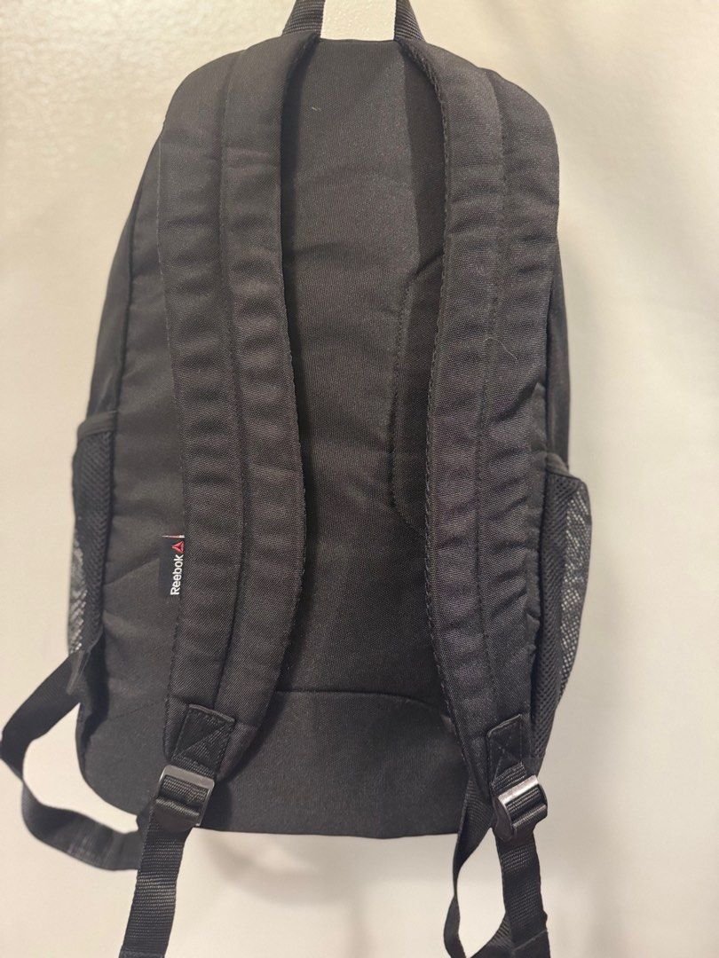 Reebok Black Backpack (Category: Backpacks) located in Quezon City. Submitted by smt00 (Listing ID 1417840500, Image 3). Description: - Side mesh pockets - Front zippered pocket - Yellow interior lining - Additional interior pockets .