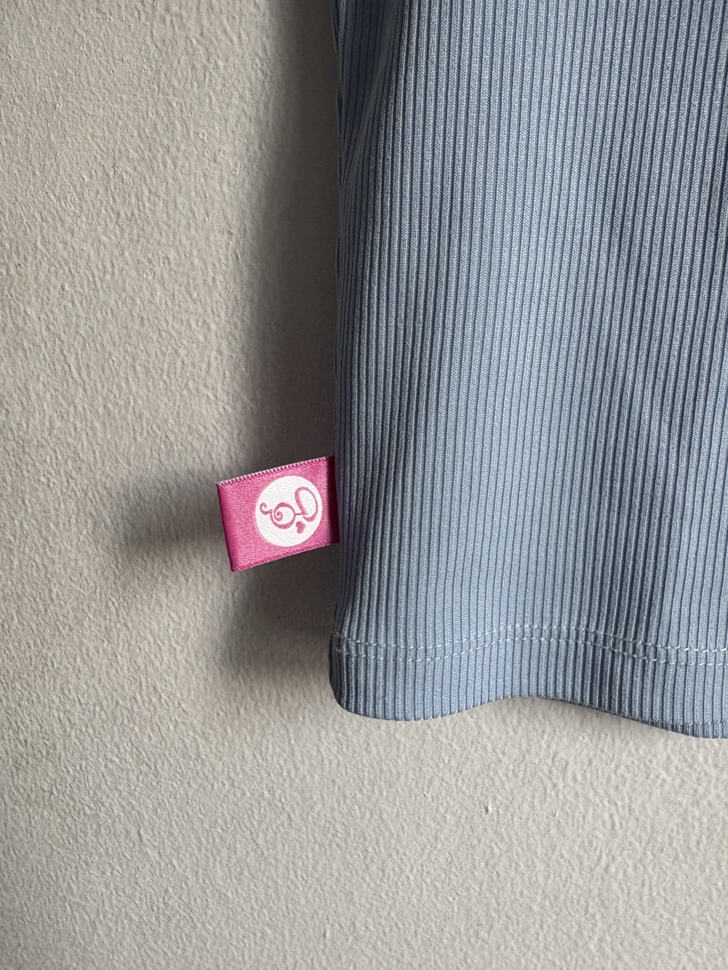 Ribbed Crop Top (Category: Shirts) located in Quezon City. Submitted by secondlifeph001 (Listing ID 1417905945, Image 2). Description: - Light blue ribbed crop top - Round neckline - Short sleeves - Lightweight fabric - Features a logo tag - Perfect for casual wear.