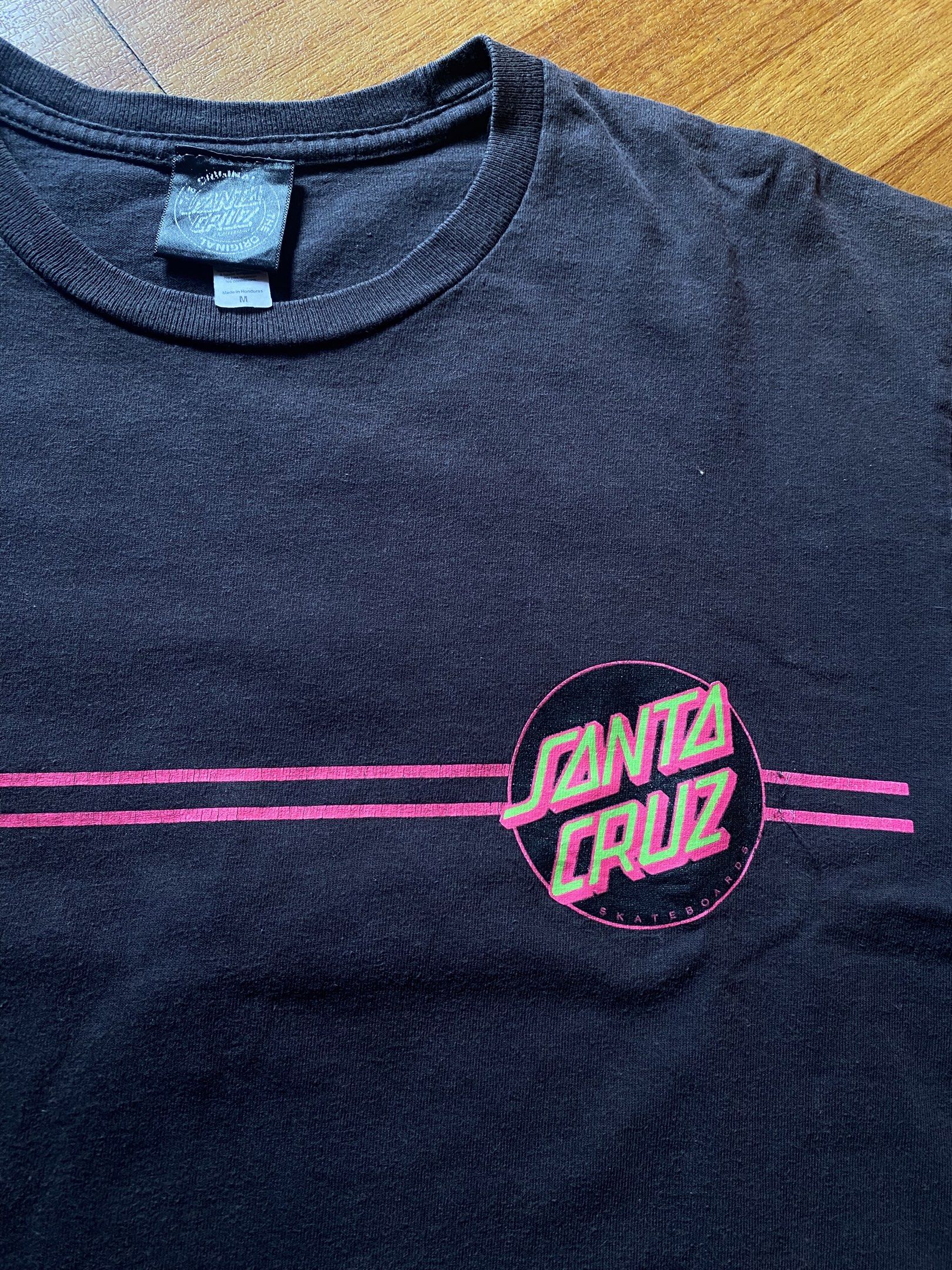 Santa Cruz Skate Tee (Category: Tshirts & Polo Shirts ) located in Santa Rosa. Submitted by fly.god (Listing ID 1417999384, Image 3). Description: Santa Cruz Skate Tee medium on tag. W”20 L”27 8/10 condition, slight crack prints and has a hole on the underarm area. can be repaired by a tailor. -skate brand ₱200 + sf.