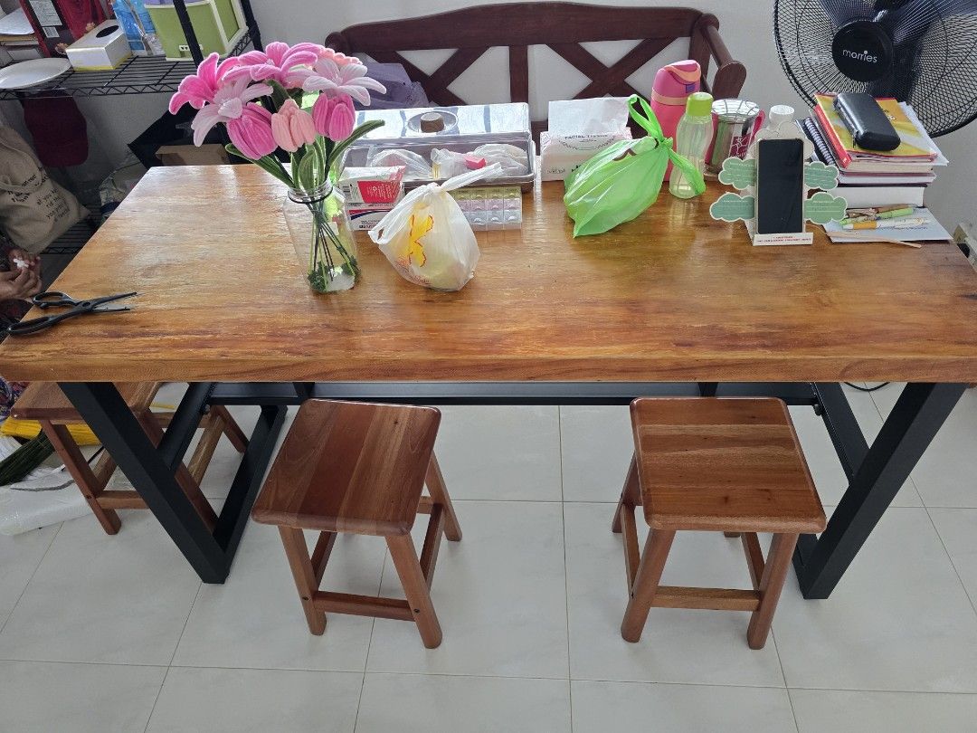 Dining Table solid wood with Stools (Category: Tables & Sets) located in Singapore. Submitted by naul175 (Listing ID 1417907225, Image 1). Description: - Solid wood dining table - Sturdy metal frame - Includes four matching 4xwooden stools - Perfect for small spaces - Natural wood grain finish 150x60x76cm.