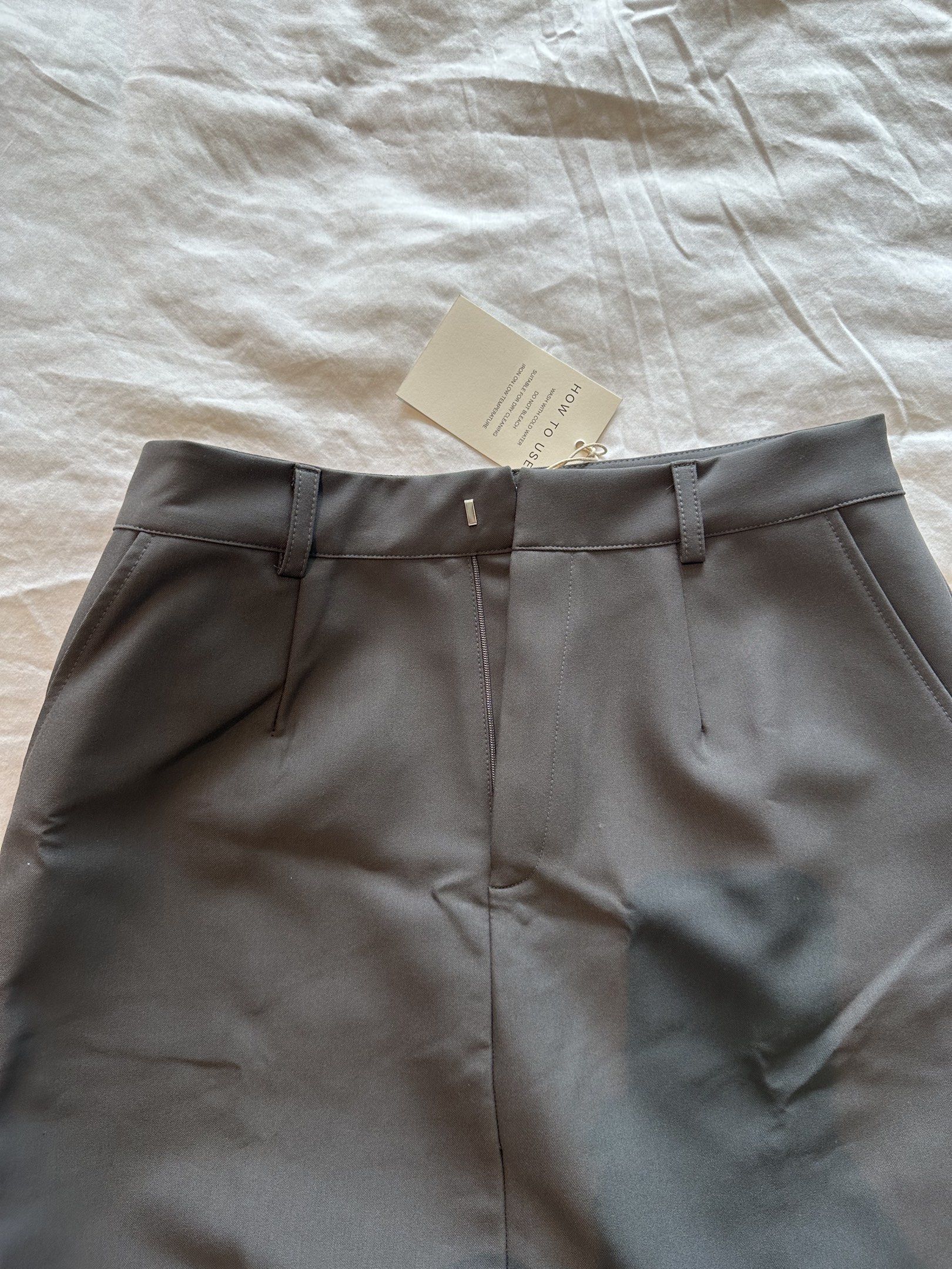 SOMS Gray Maxi Skirt - Size L (Category: Skirts) located in Quezon City. Submitted by krishagee (Listing ID 1417889334, Image 2). Description: - SWOS gray maxi skirt - Size: L - High-waisted - Button closure - Features pockets - Material: Smooth, woven fabric - Silhouette: Long, straight.