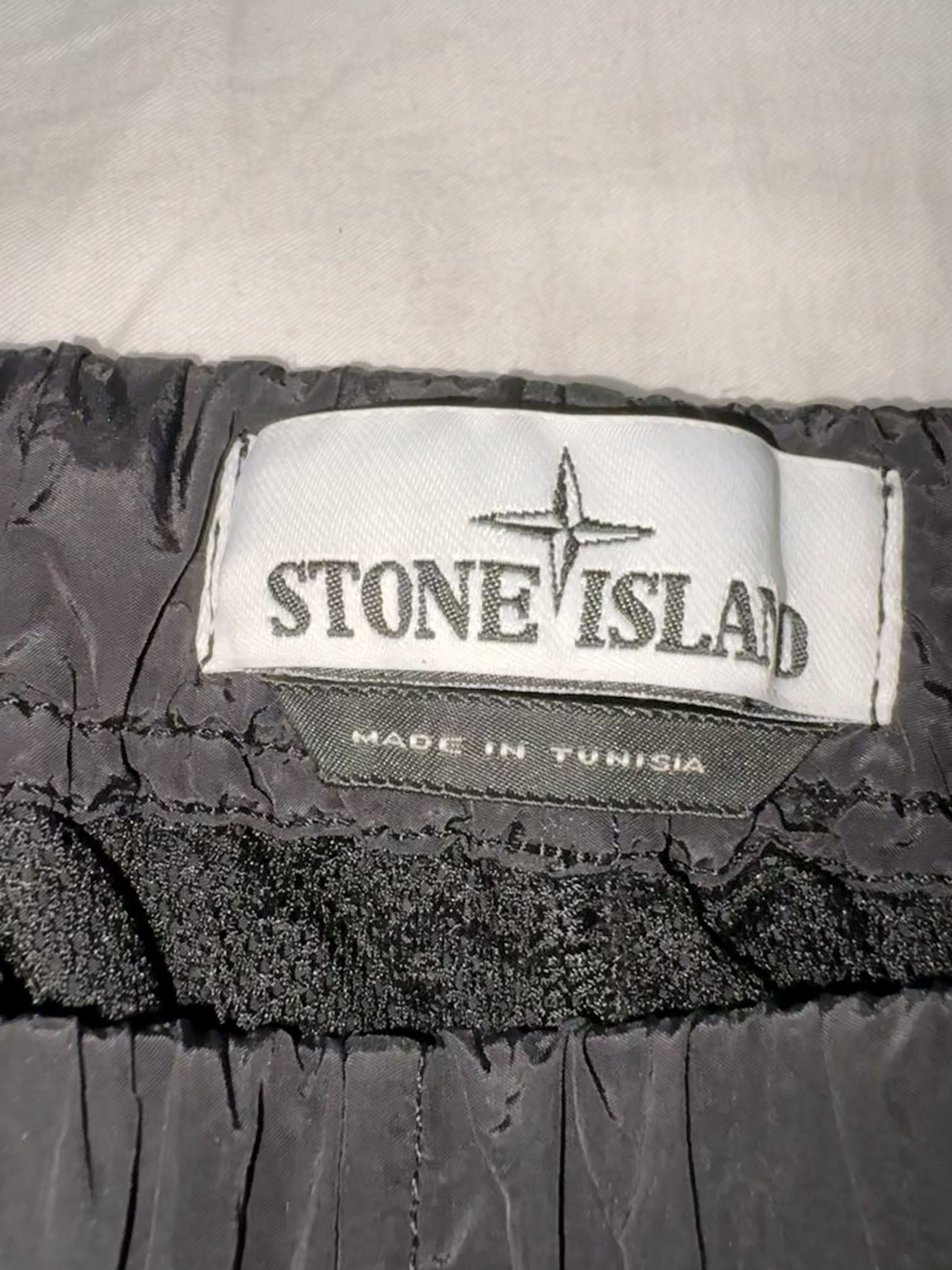 Stone Island Black Nylon Pants (Category: Trousers) located in Taguig. Submitted by homieplugph (Listing ID 1417996145, Image 3). Description: - Authentic Stone Island black nylon pants - Iconic Stone Island badge - Drawstring waist - Zippered pockets - Includes authentication tag with QR code - Made in Tunisia - Bought in Farfetch.