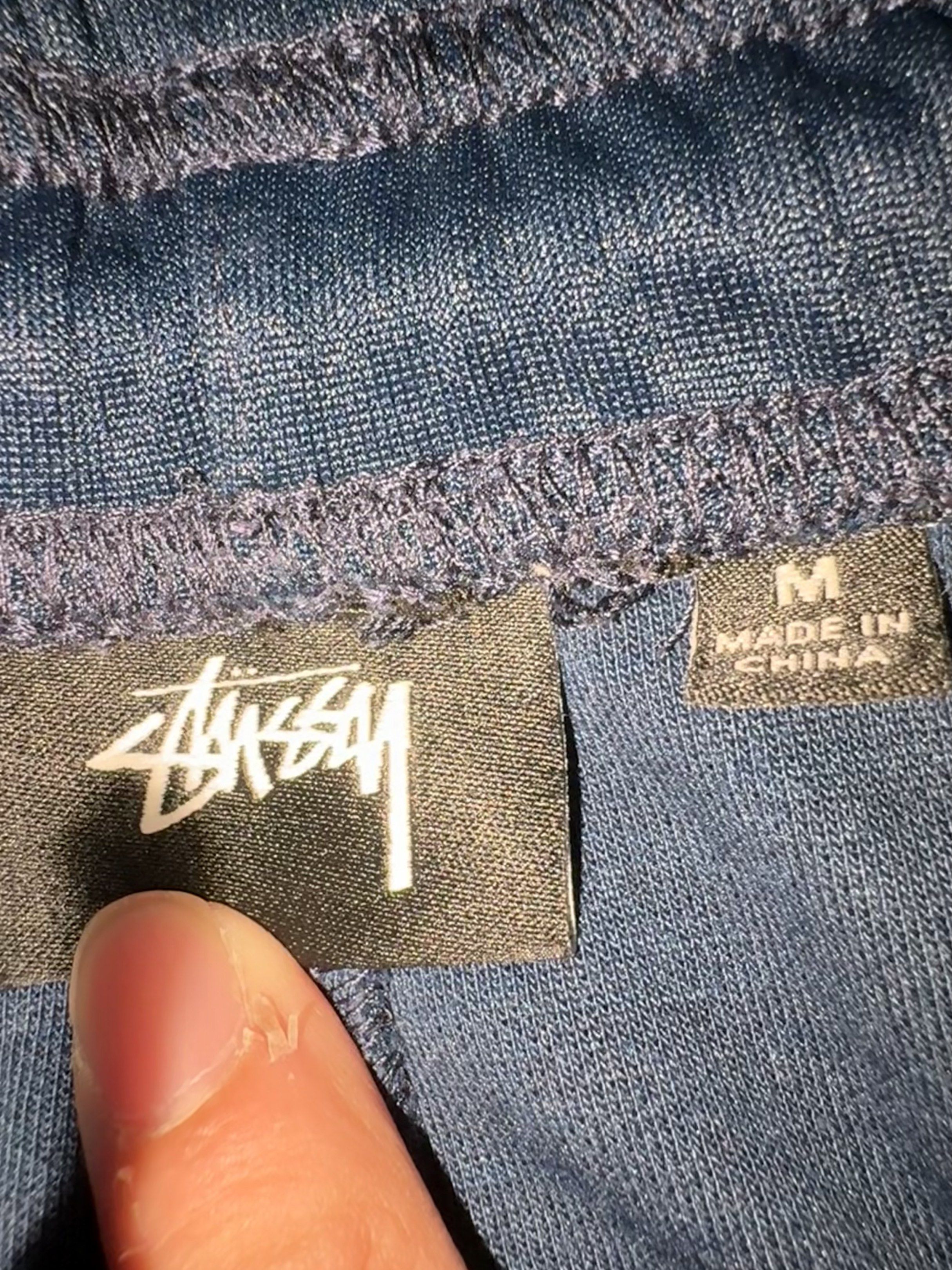 Stussy Track Pants - Navy Blue (Category: Joggers) located in Taguig. Submitted by homieplugph (Listing ID 1417996111, Image 2). Description: - Stussy track pants - Color: Navy blue with maroon side stripe - Features Stussy logo - Size: Medium - Elastic waistband with drawstring - Made in China - Authentic.