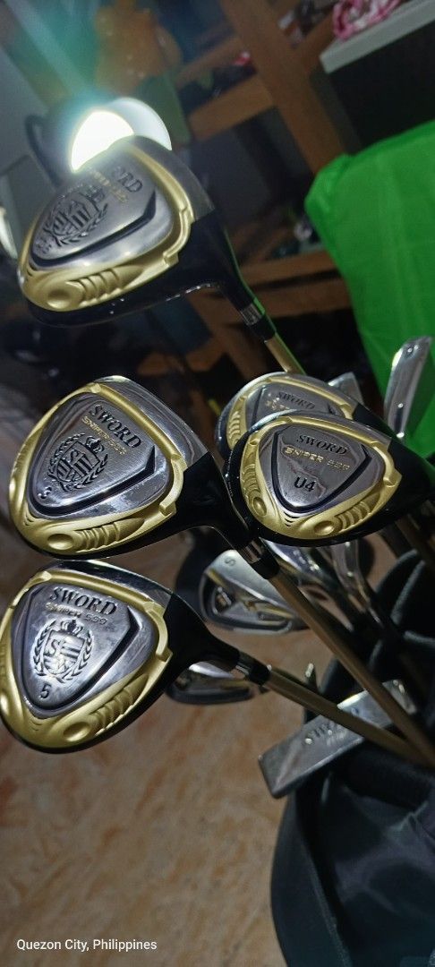 Sword Sniper Golf Club Set (Category: Golf) located in Manila. Submitted by yeonmei5614747 (Listing ID 1417949723, Image 2). Description: - Complete Sword golf club set - Includes drivers, irons, and putter - Comes with a golf bag - Stylish gold and silver color scheme -iron#6-9 S P A -Driver 10 . 5 loft 460 cc -5wood -3wood -U4 -U5 -Putter - Head covers for drivers and fairway woods - Ideal for beginners and experienced golfers -Right Handed set