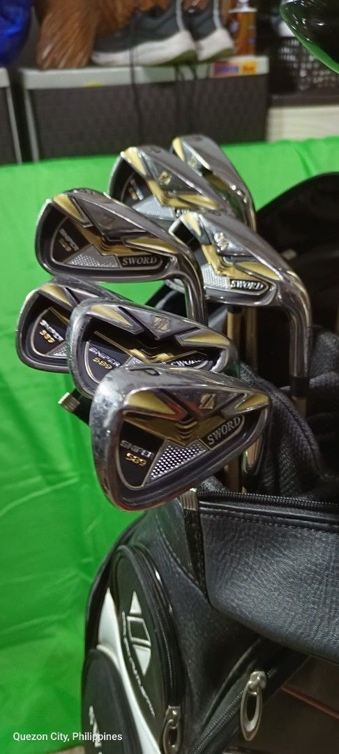 Sword Sniper Golf Club Set (Category: Golf) located in Manila. Submitted by yeonmei5614747 (Listing ID 1417949723, Image 3). Description: - Complete Sword golf club set - Includes drivers, irons, and putter - Comes with a golf bag - Stylish gold and silver color scheme -iron#6-9 S P A -Driver 10 . 5 loft 460 cc -5wood -3wood -U4 -U5 -Putter - Head covers for drivers and fairway woods - Ideal for beginners and experienced golfers -Right Handed set