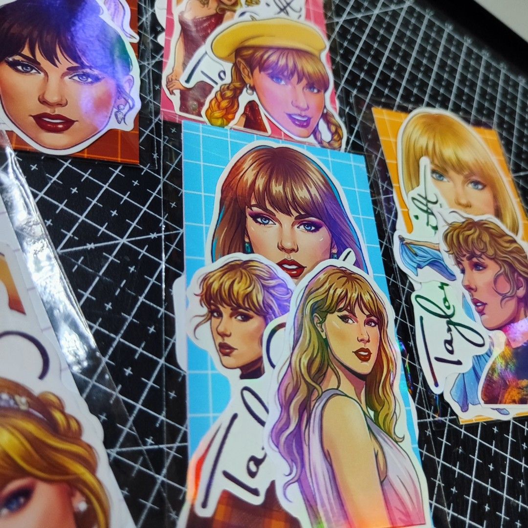 Taylor Swift Stickers (Category: Western Merchandise) located in Bulacan. Submitted by somethingblue02 (Listing ID 1417889543, Image 2). Description: - Taylor Swift sticker set - Features various designs and eras - Individually packaged - Includes images of Taylor Swift - Stickers have a holographic effect - Perfect for notebooks, journaling, calendars. - These are regular stickers onlyyy.
