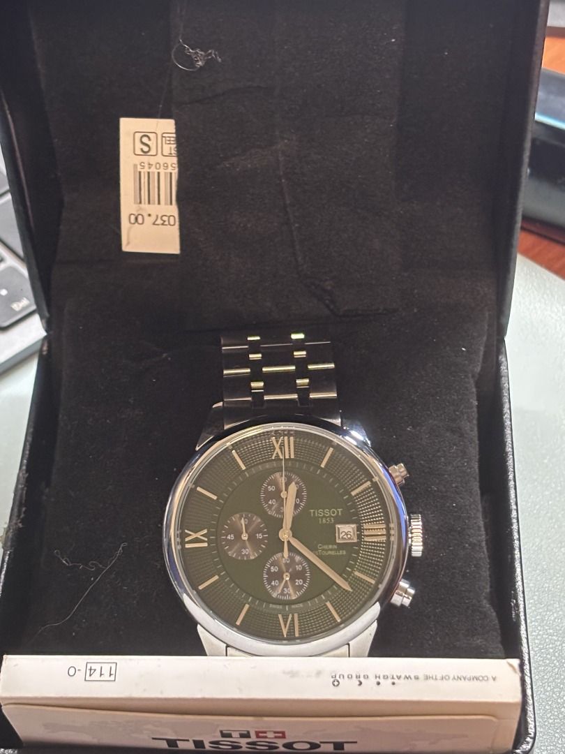 Tissot Chemin Des Tourelles Chronograph (Category: Luxury Watches) located in Makati City. Submitted by safefire-d3b0b8 (Listing ID 1417862537, Image 1). Description: - Tissot watch with a striking green dial - Features chronograph subdials and a date display - Durable stainless steel case and bracelet - Water-resistant design - Scratch-resistant sapphire crystal - Model number: T099.407 - Includes original box Sold as is where is The Chemin Des 