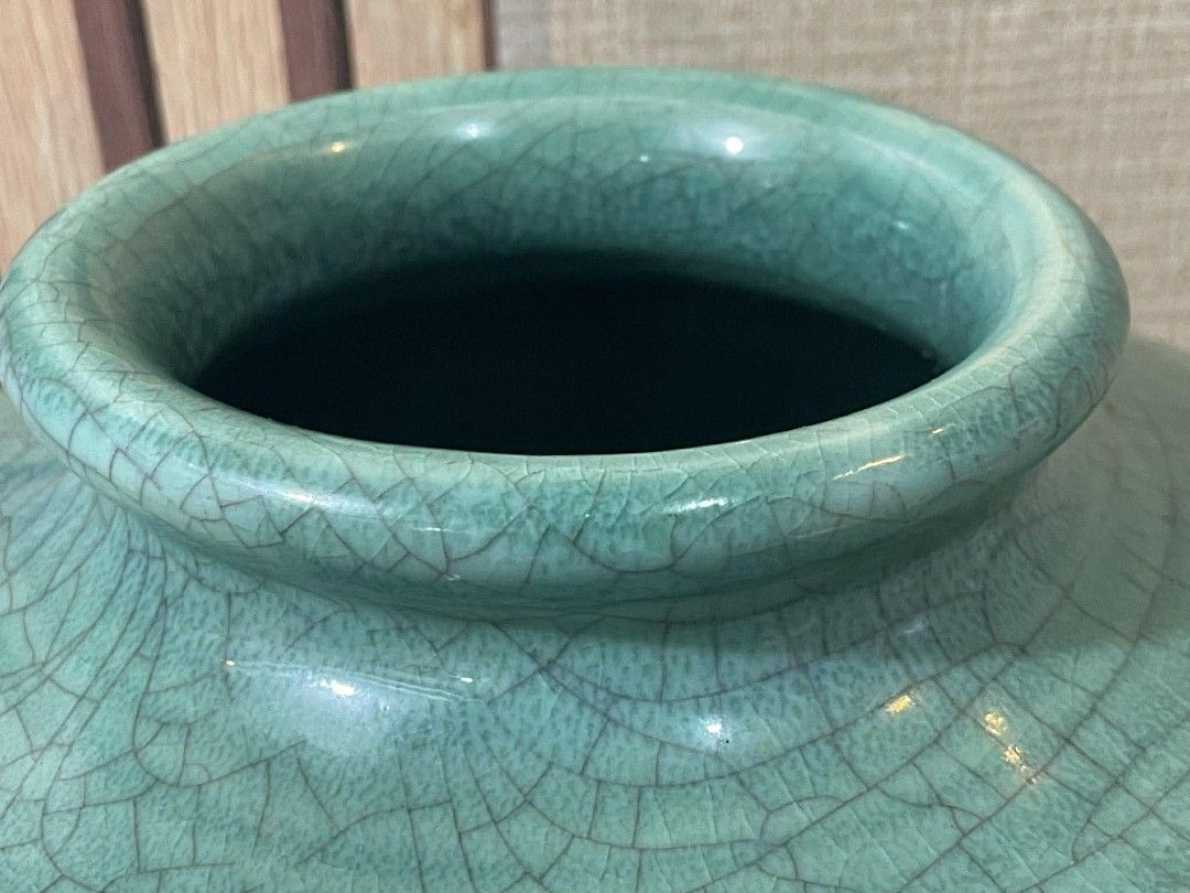 Vintage Celadon Crackle Glaze Vase (Category: Vases & Decorative Bowls) located in Manila. Submitted by ph_collection (Listing ID 1417976672, Image 3). Description: - Vintage celadon vase - Unique crackle glaze - Two-tone design: lighter green base, turquoise upper - Distinctive shape: flared base, narrow neck - Approximately 11 inches tall - Approximately 9 inches diameter - Stamped base.