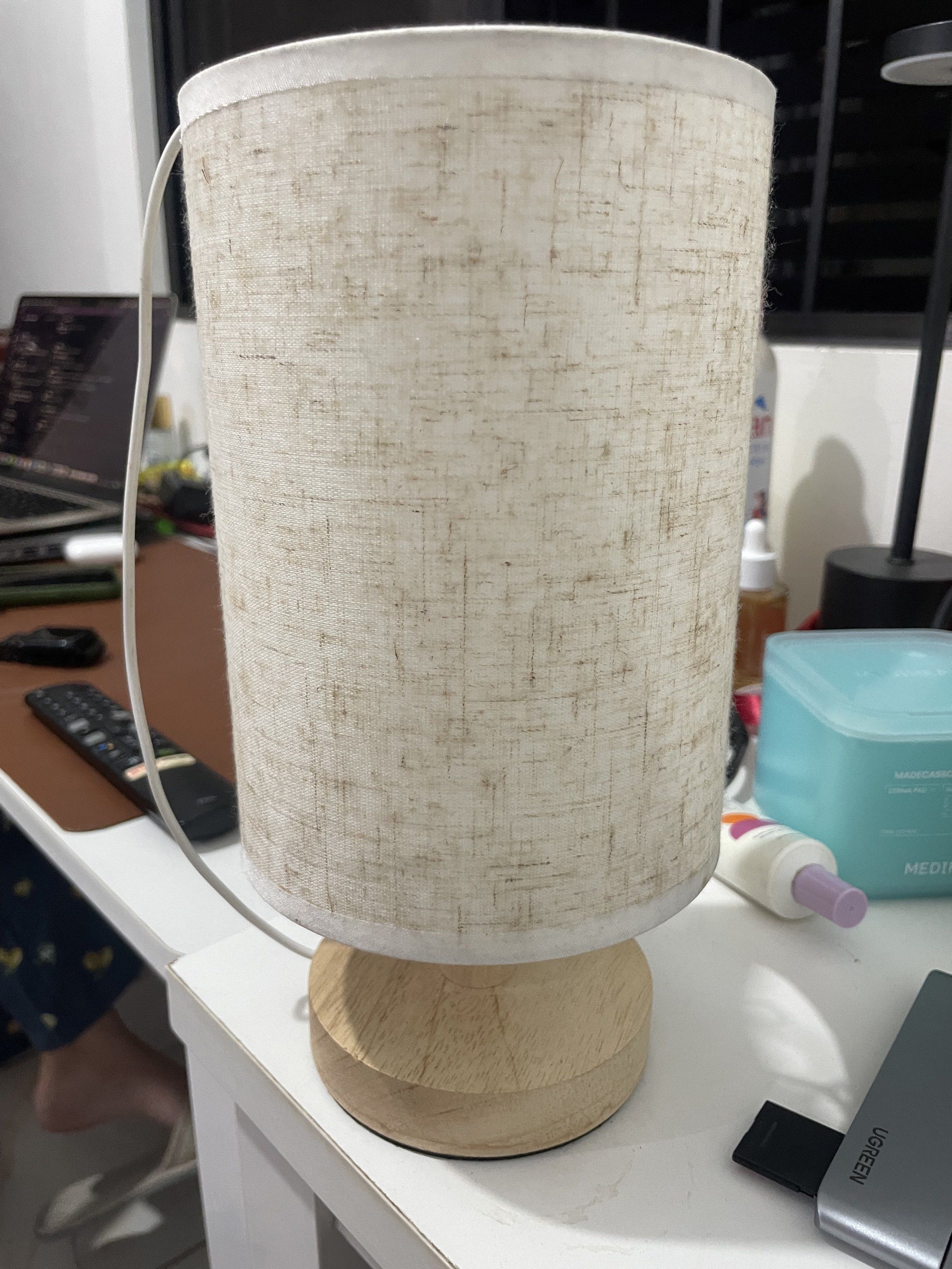 Wooden Base Table Lamp with Fabric Shade (Category: Lighting) located in Rizal. Submitted by legendiaries (Listing ID 1417920855, Image 2). Description: - Cylindrical fabric shade - Wooden base - Neutral color palette - Includes power cord - Simple and elegant design - Perfect for ambient lighting.