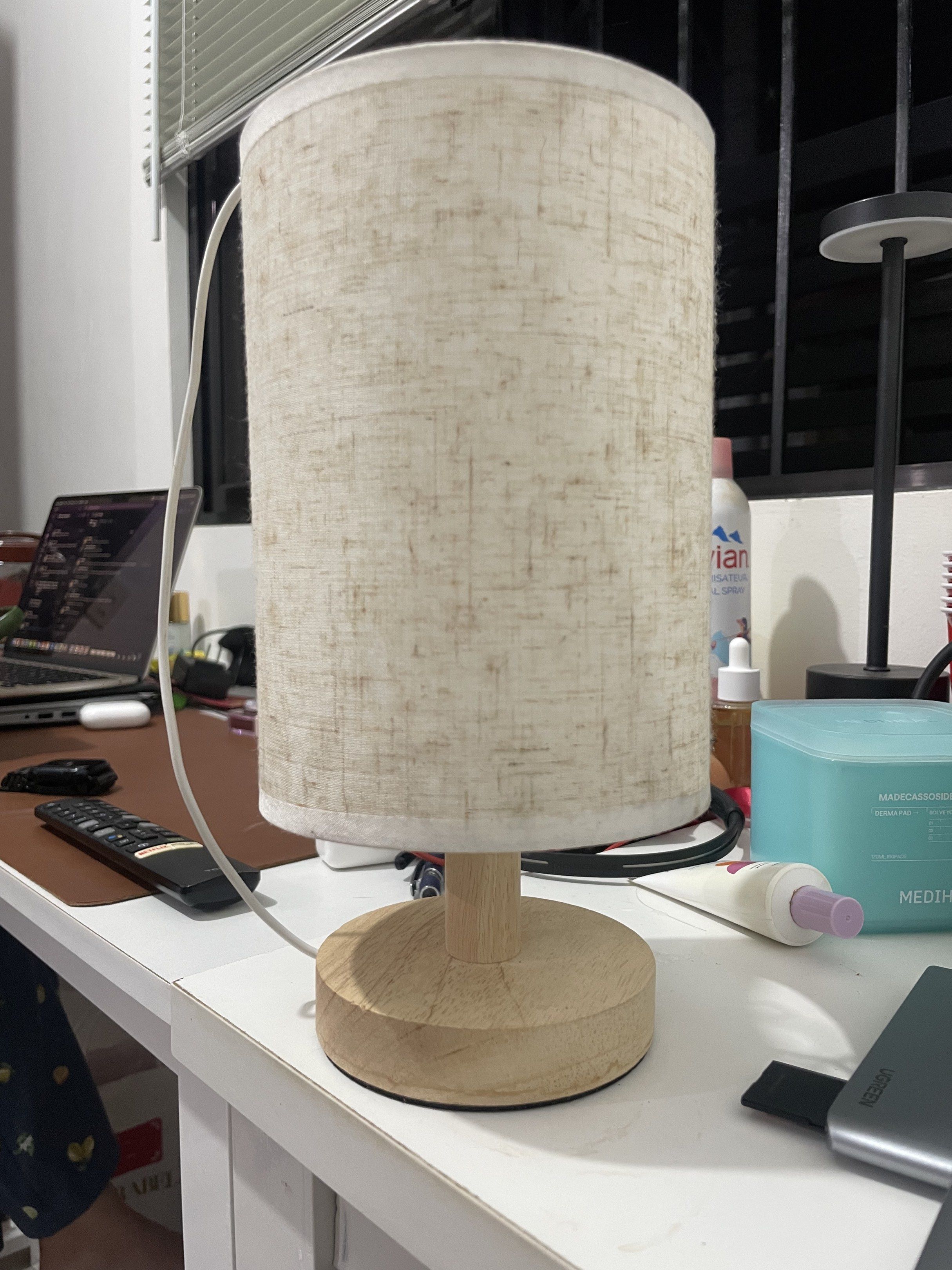 Wooden Base Table Lamp with Fabric Shade (Category: Lighting) located in Rizal. Submitted by legendiaries (Listing ID 1417920855, Image 1). Description: - Cylindrical fabric shade - Wooden base - Neutral color palette - Includes power cord - Simple and elegant design - Perfect for ambient lighting.