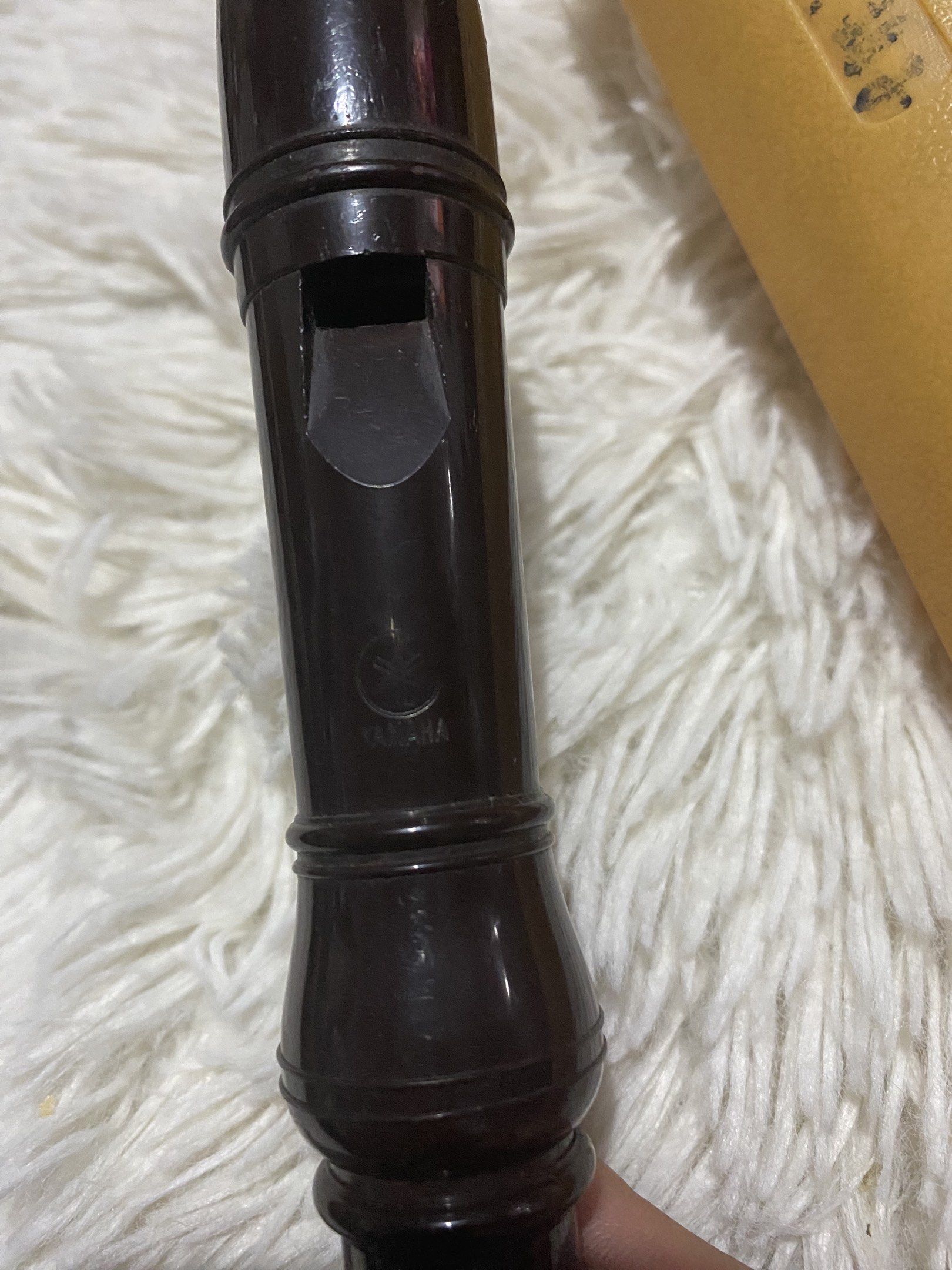 Yamaha Recorder (Category: Voice Recorders) located in Bulacan. Submitted by rich2545 (Listing ID 1417927378, Image 2). Description: - Yamaha recorder with case - Recorder color: Dark brown - Case color: Yellow - Yamaha logo present on recorder and case.