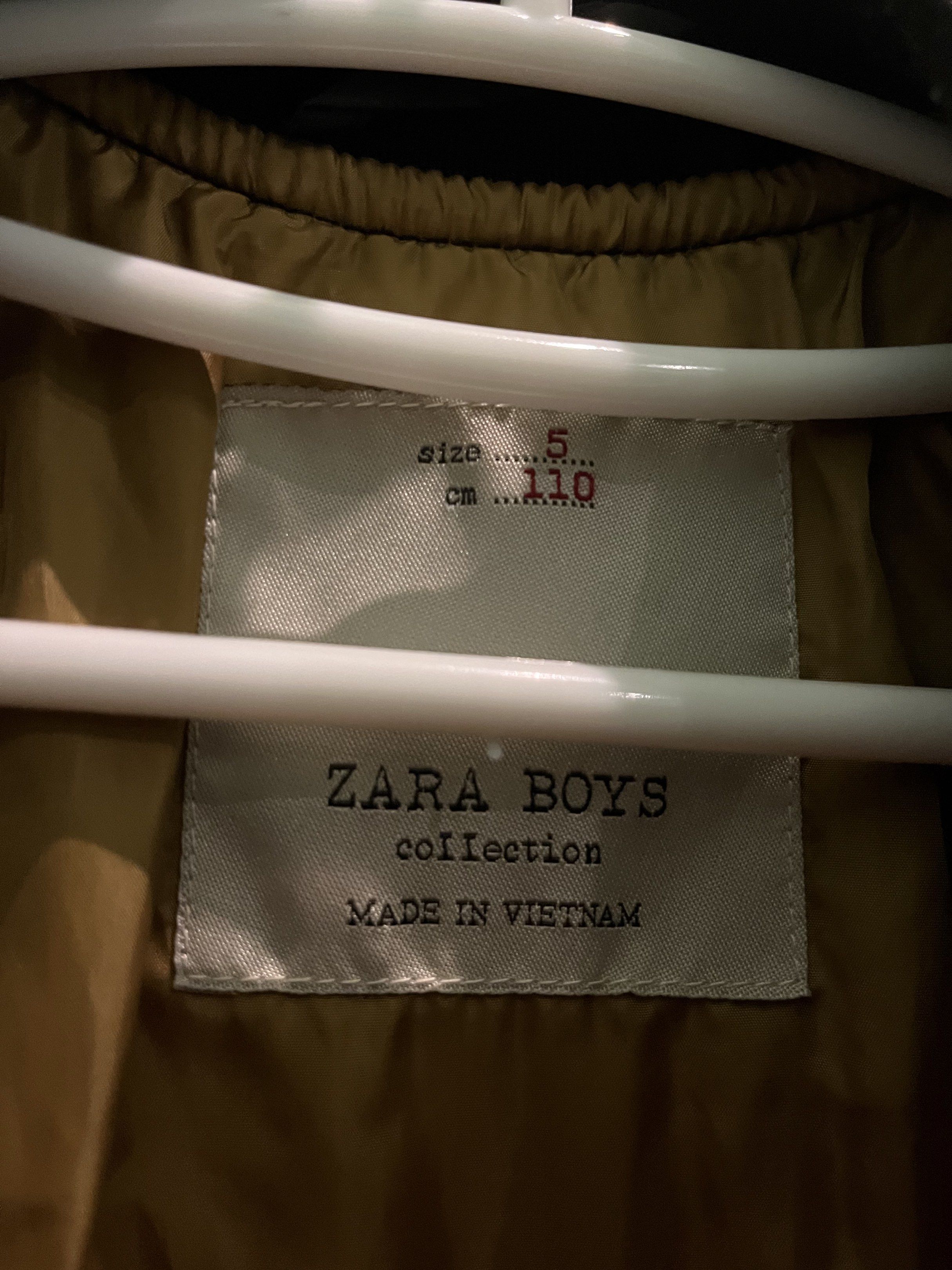 Zara Boys Bomber Jacket Size 5 (Category: Babies & Kids Fashion) located in Pasig City. Submitted by fmc828 (Listing ID 1417817096, Image 2). Description: - Zara Boys black bomber jacket - Size 5 (fits 110 cm) - Quilted design - Features "UNDER" and "76" patches - Two front pockets - Ribbed collar, cuffs, and hem - Made in Vietnam.