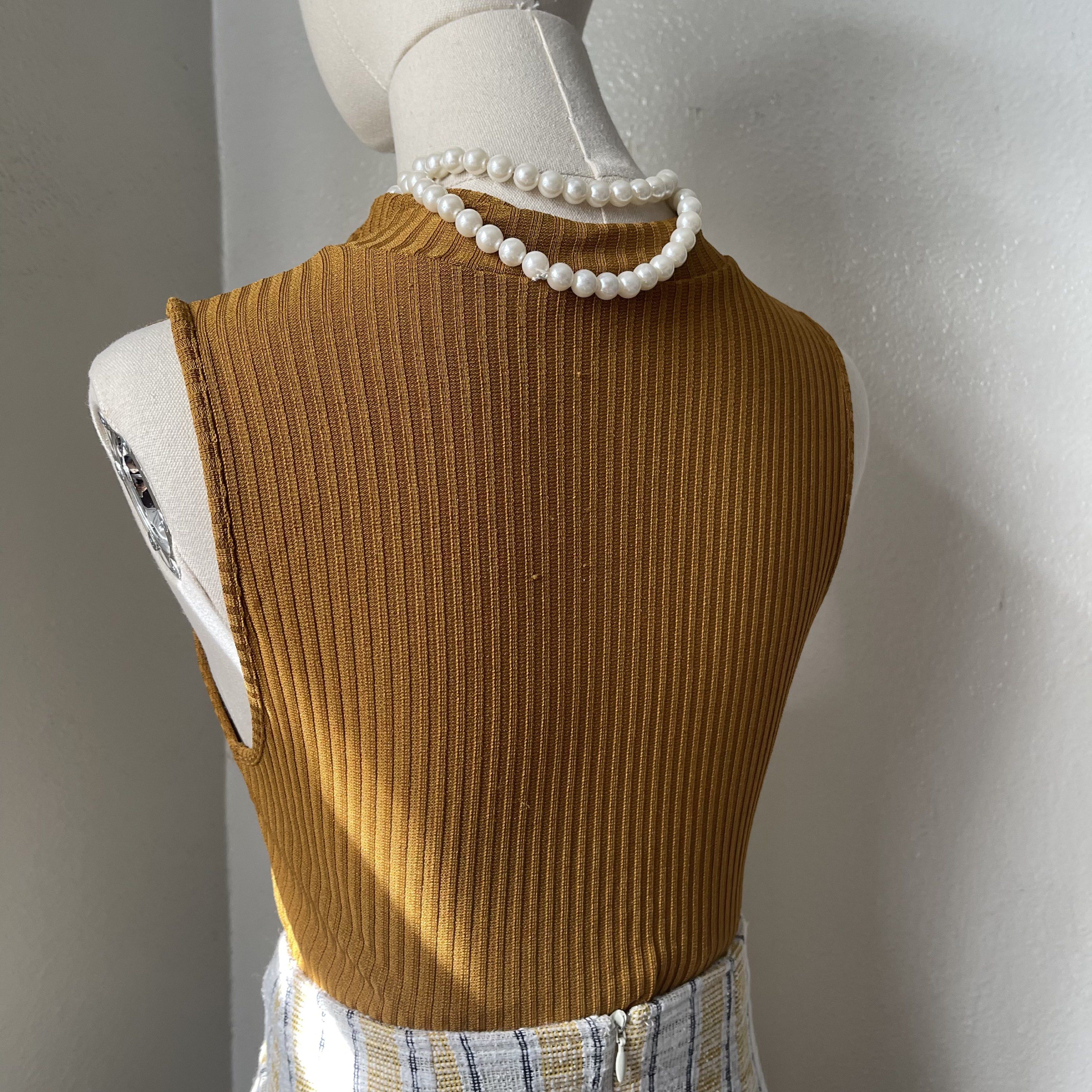 Zara Mustard Ribbed Sleeveless Top (Category: Sleeveless) located in Norzagaray. Submitted by preloved.bul (Listing ID 1417928540, Image 3). Description: - Mustard ribbed sleeveless top - High neckline with zipper - Fitted silhouette - Versatile for any occasion - Effortless chic look.