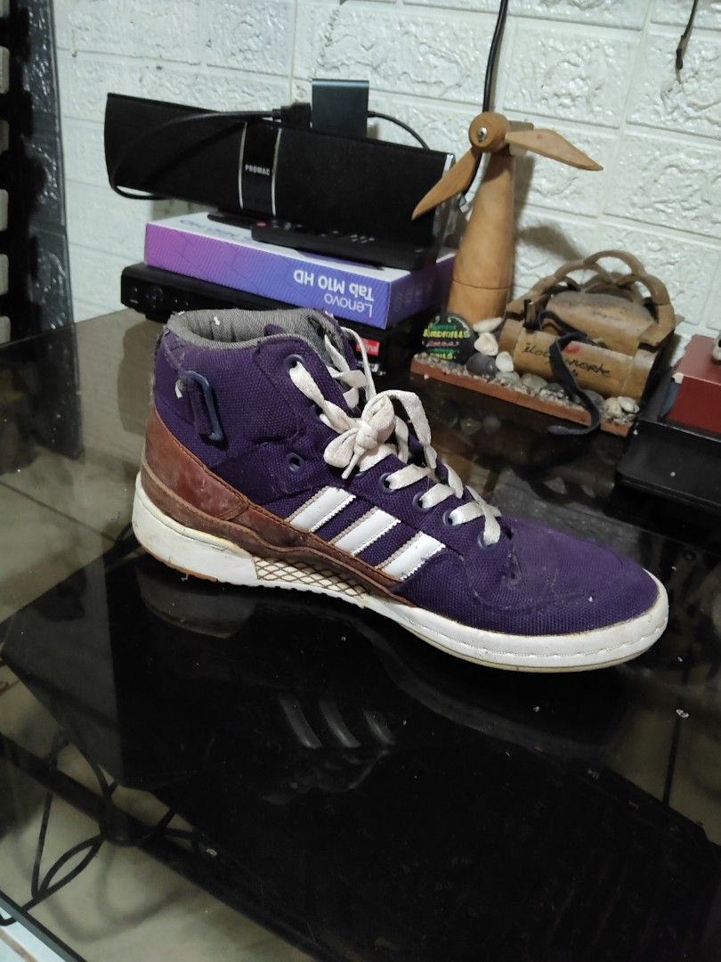 Adidas Forum Mid Purple Sneakers (Category: Sneakers) located in San Mateo. Submitted by dealrose032 (Listing ID 1418024342, Image 1). Description: - Adidas Forum Mid sneakers - Color: Purple and brown - White Adidas three stripes - Brown and white soles - High-top style - Features laces and strap - Shows some wear on soles.