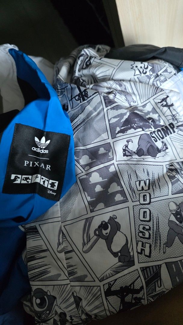 Adidas x Pixar Limited Edition Jacket (Category: Coats, Jackets and Outerwear) located in Mandaluyong City. Submitted by KenP07 (Listing ID 1418070272, Image 3). Description: - Adidas x Pixar Limited Edition Jacket - Size: L/XL - Color: White body with blue sleeves - Features comic-style print inner lining - Hooded with zipper closure - Includes Adidas logo and Pixar label Adidas X Pixar collab Limited Edition X/XL ₽2,500 Pickup : SMDC Light Resi