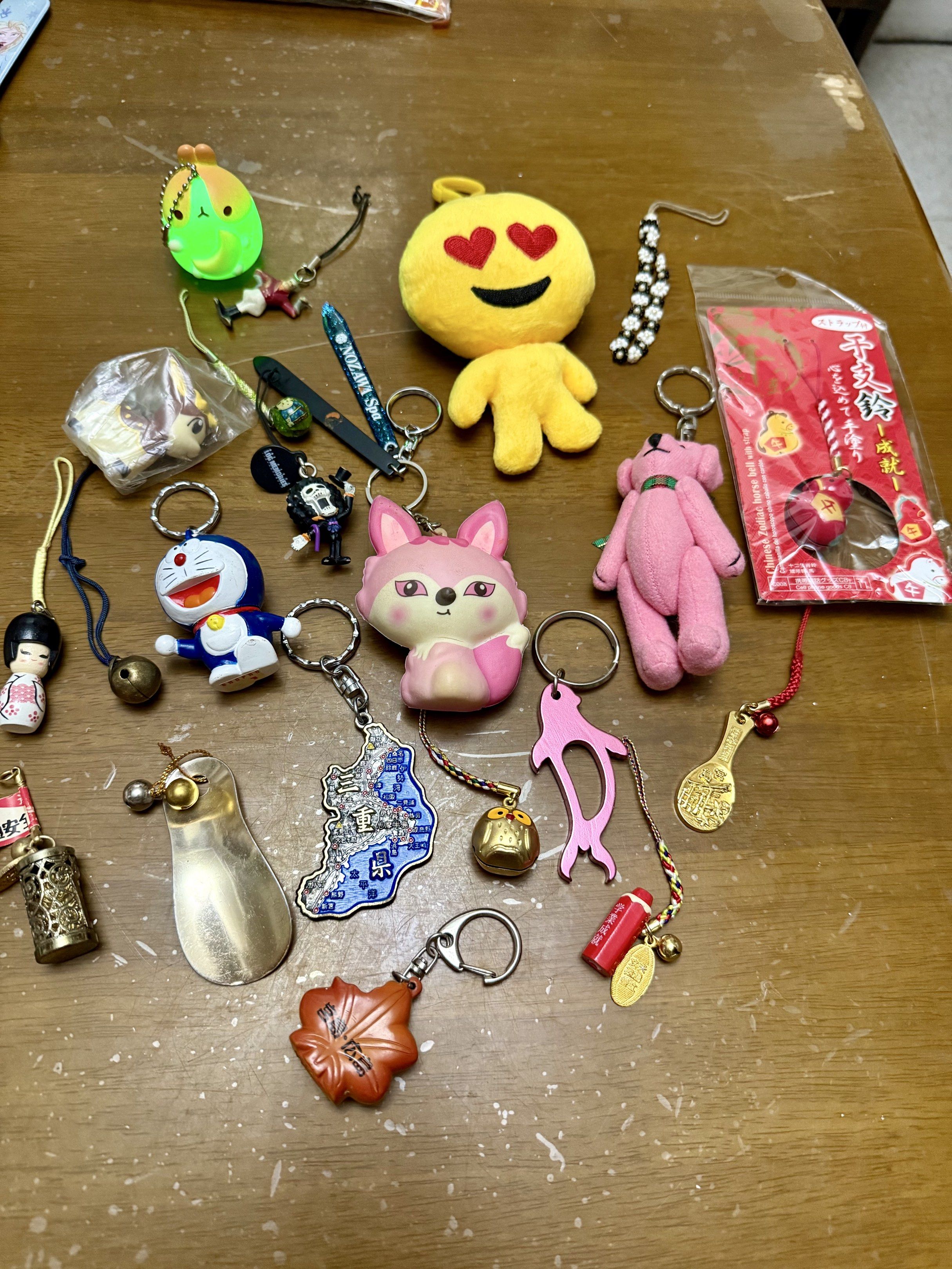 Assorted Keychains - Doraemon, Fox, Bear, etc. (Category: Character Goods) located in Pilar. Submitted by faveanyshop (Listing ID 1418020198, Image 2). Description: - Variety of keychains available! - Designs include: - Doraemon - Pink fox - Pink bear - Yellow emoji - Japanese-style charms - Dolphin - Map - One Piece character - Some keychains feature bells and additional charms..