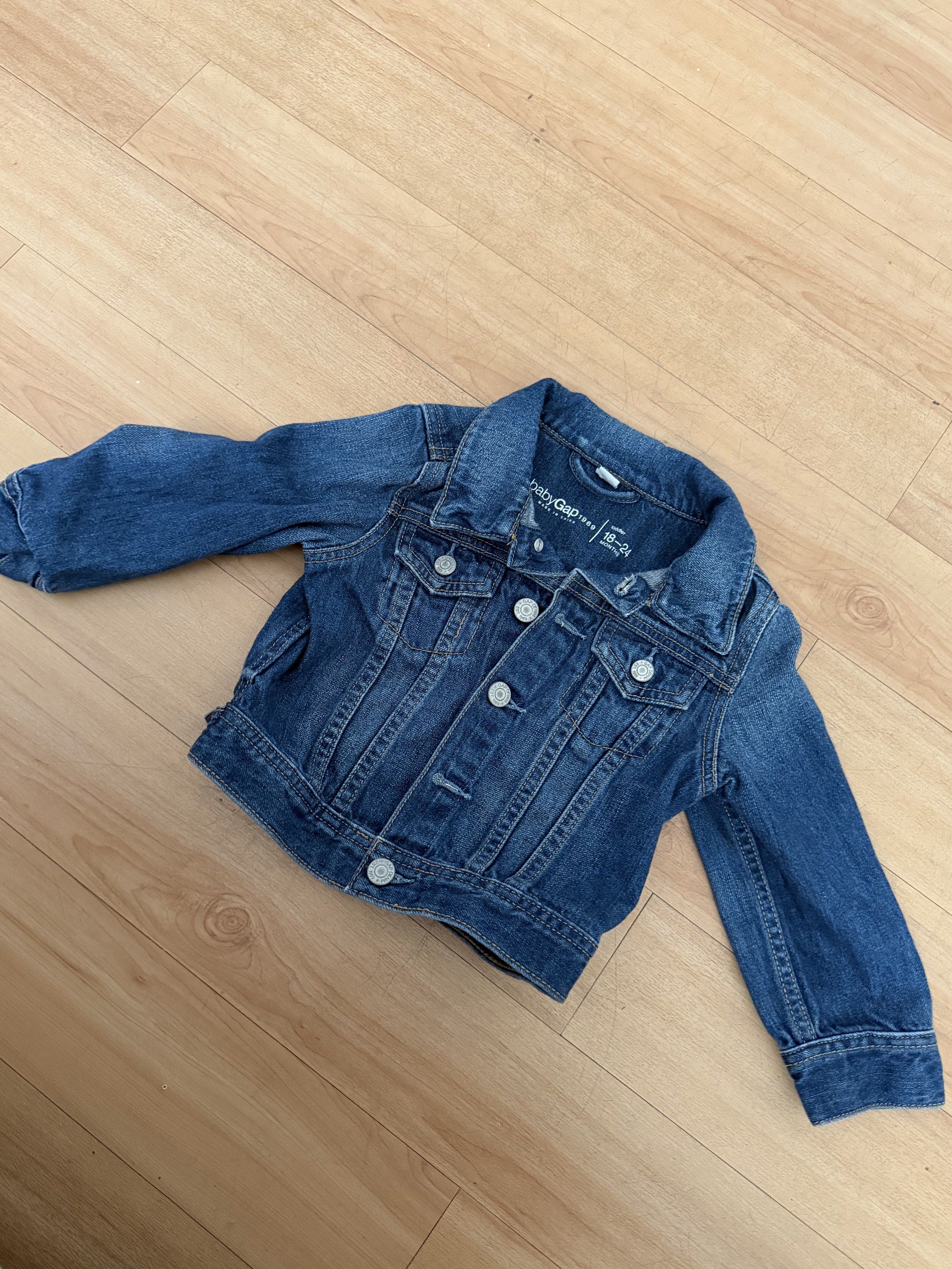 Baby Gap Denim Jacket 18-24 Months (Category: Babies & Kids Fashion) located in Quezon City. Submitted by griveraa1224 (Listing ID 1418206937, Image 1). Description: - Baby Gap denim jacket - Size: 18-24 months - Classic design - Button closures - Collared neckline - Made in China - Great for layering.