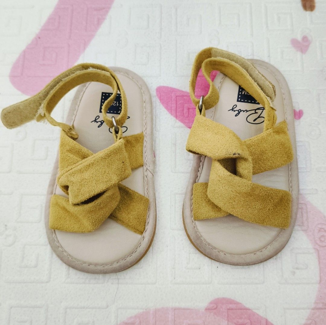 Baby Sandals Size 12cm (Category: Babies & Kids Fashion) located in Makati City. Submitted by janeg15 (Listing ID 1418055732, Image 1). Description: - Adorable mustard yellow baby sandals - Features a cross-strap design - Adjustable ankle strap for a secure fit - Size 120 - Perfect for summer.