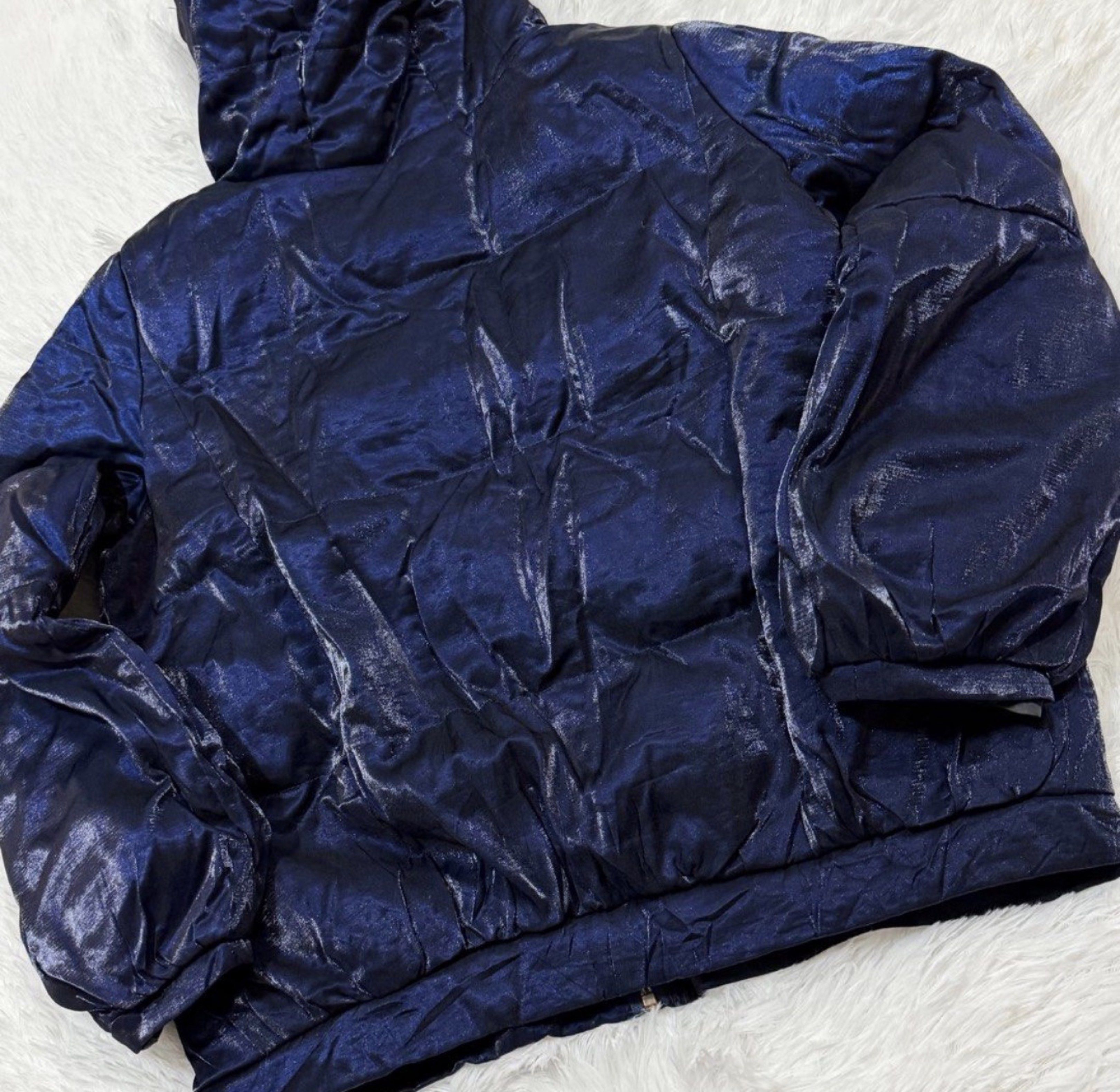Blue - Black / Dark Blue Puffer Jacket with Hood (Category: Coats, Jackets and Outerwear) located in Manila. Submitted by ipurpleucart (Listing ID 1418060912, Image 3). Description: - Navy blue puffer jacket - Features a hood - Front zipper closure - Two front pockets - Shiny, textured appearance - Long sleeves - Quilted design - Warm and stylish outerwear.