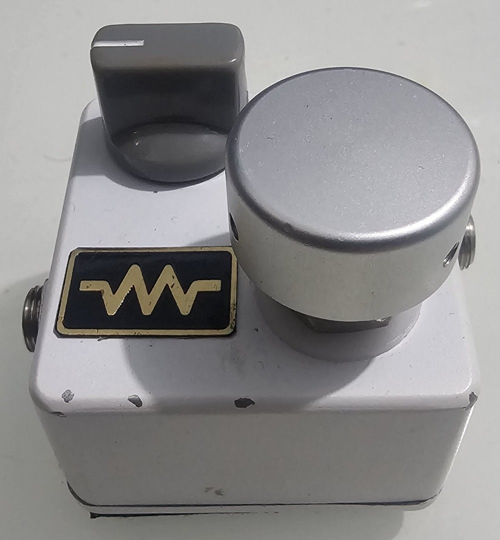 Boost Pedal Effects (Category: Music Accessories) located in Pasay City. Submitted by gasattack (Listing ID 1418034348, Image 2). Description: - White enclosure with a distinctive wave logo. - Two control knobs for sound shaping. - Blue LED indicator. - Standard input and output jacks. - Compact and unique effect unit..