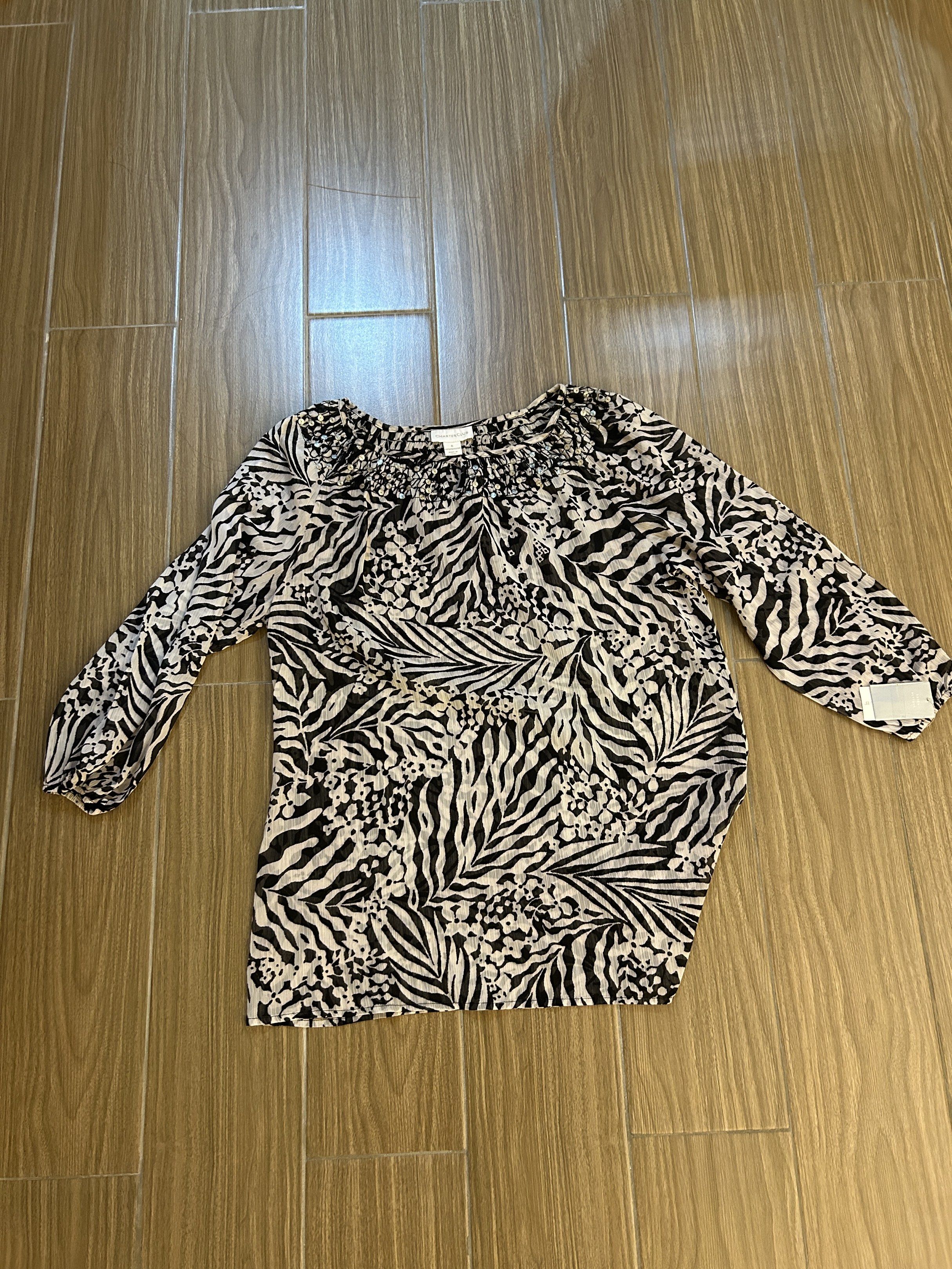 Charter Club Printed See-Through Blouse (Category: Blouses) located in San Juan City. Submitted by curatedbymae (Listing ID 1418163191, Image 3). Description: Item: Charter Club Printed See-through Blouse - Charter Club is a premium women’s clothing brand in USA. Size: US 6 RFS: decluttering Mode of Payment: GCASH/MAYA/Bank transfer Shipping: J&T/Grab/Lalamove (Buyer will shoulder the shipping fee.).