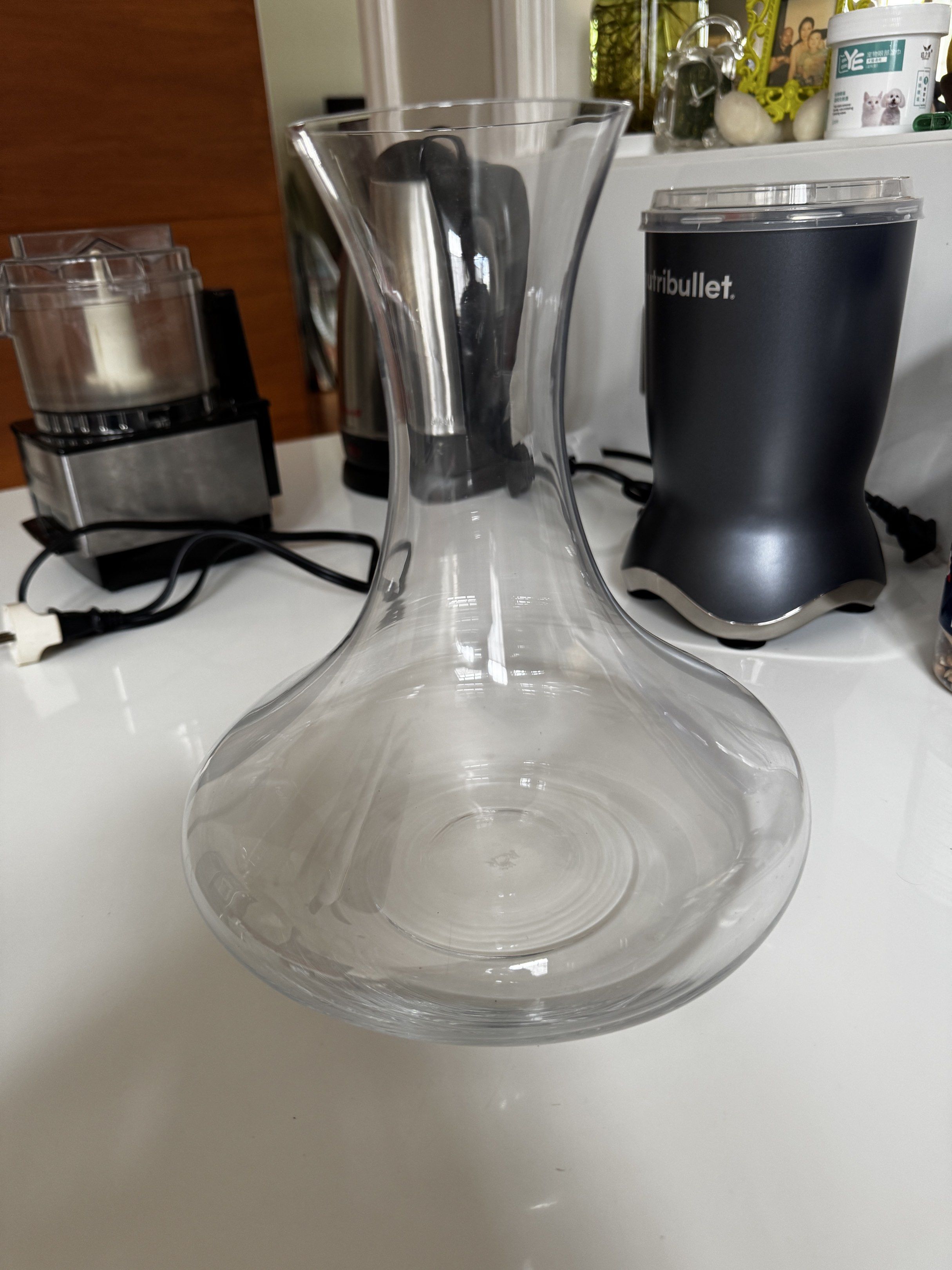 Clear Glass Wine Decanter (Category: Other Kitchenware & Tableware) located in Quezon City. Submitted by tulip03 (Listing ID 1418035933, Image 1). Description: - Elegant glass wine decanter - Wide base and flared top design - Improves wine breathing for better taste - Perfect for aerating and serving wine - Great addition to your home bar or dining area.