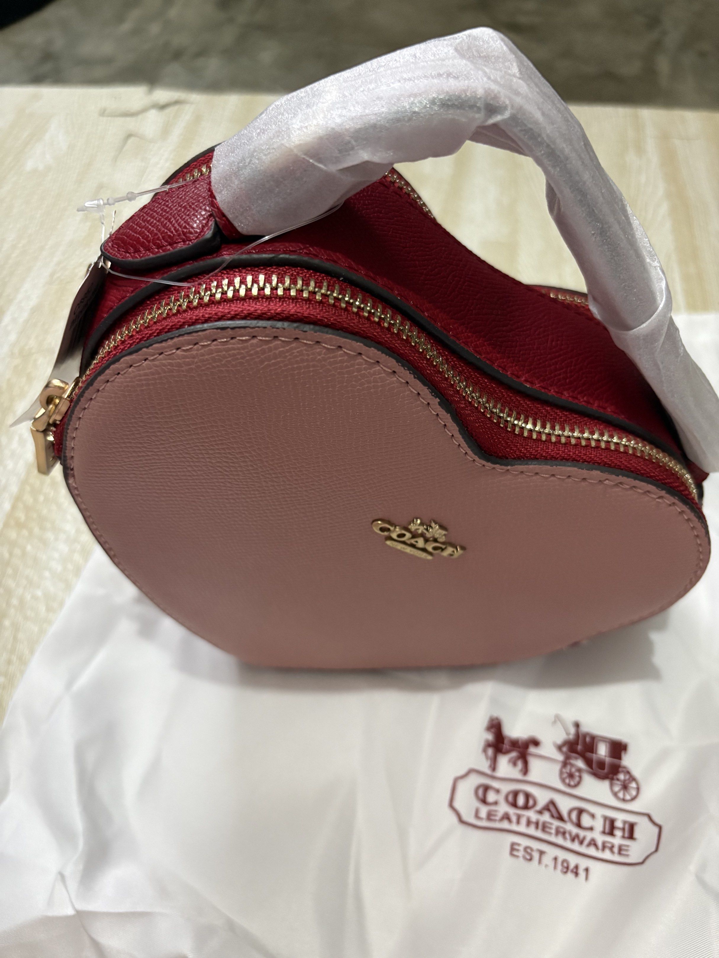 Coach Heart-Shaped Handbag (Category: Luxury Bags & Wallets) located in Mandaue City. Submitted by denden22222 (Listing ID 1418189175, Image 2). Description: Valentine’s day ready bag perfect to match with your ootd ❤️ pink & red color combo. Vietnam made coach heart bag // Cebu location.