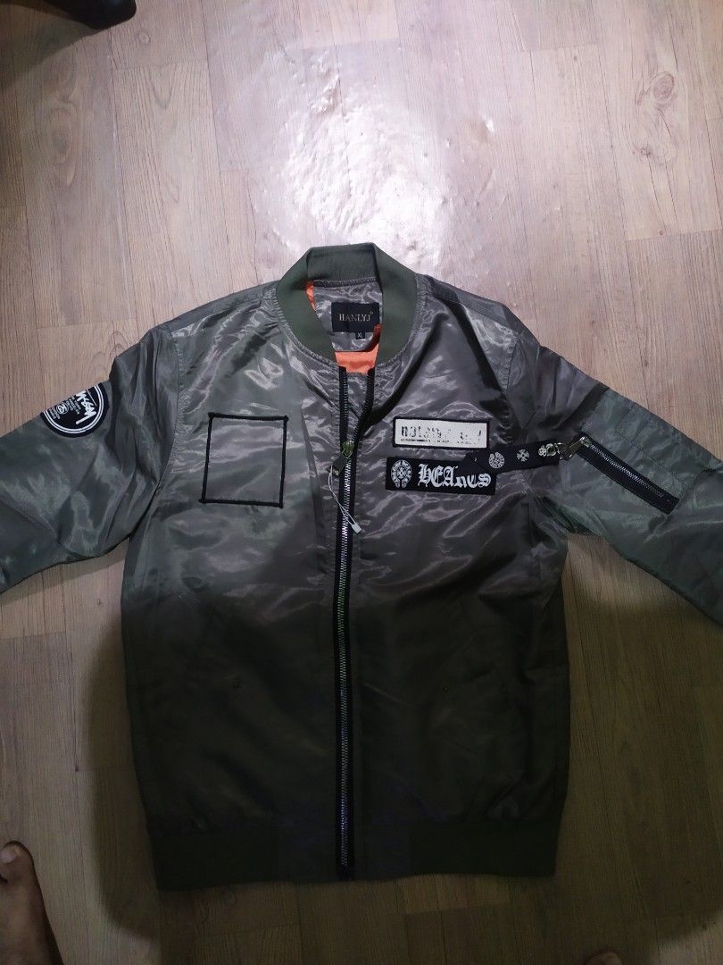 C.O.D. Pilot Bomber Jacket (Category: Coats, Jackets and Outerwear) located in Malabon City. Submitted by paolojohnlopez11 (Listing ID 1418034988, Image 3). Description: - Stylish green bomber jacket - Orange interior lining - Features patches (Stussy, chrome Hearts) - Zipper closure - Ribbed collar - Includes an inside pocket -Decluttering nabura na Ang print Niya dahil matagal na na stock sa drawer ko makikita sa pic Ang issue may minimal na pi