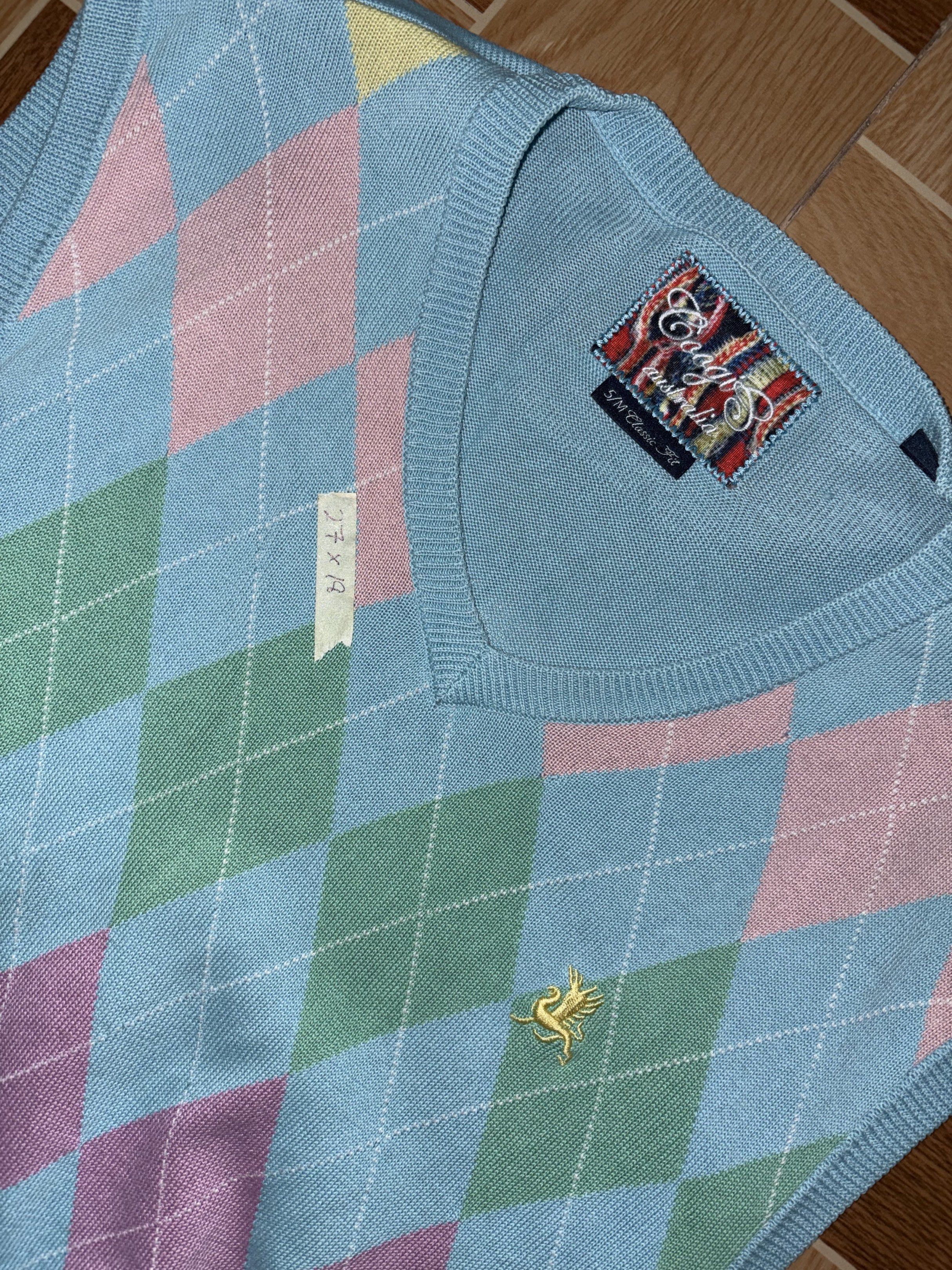 Coogi Argyle Vest (Category: Vests) located in Quezon City. Submitted by batch. (Listing ID 1418075028, Image 3). Description: - Coogi argyle vest - Pastel color scheme - V-neck design - Embroidered Coogi logo - Classic argyle pattern (light blue base) - Various colored diamonds - Authentic Coogi brand tag.