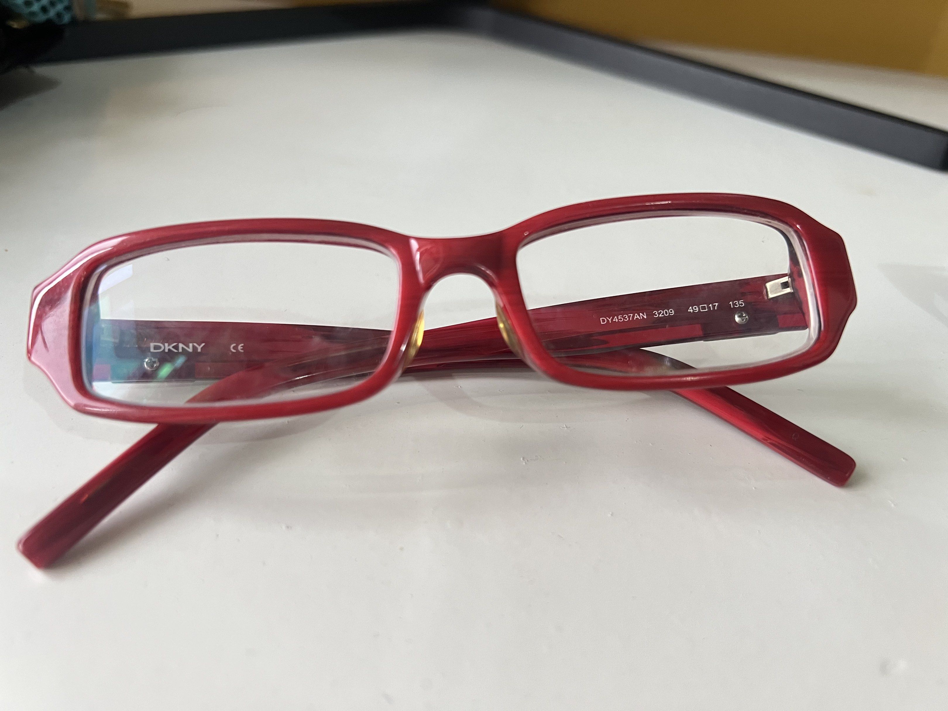 Authentic DKNY Eyeglasses OY4537AN 3209 (Category: Sunglasses & Eyewear) located in Quezon City. Submitted by bubspreloved (Listing ID 1418081400, Image 1). Description: - DKNY eyeglasses - Model: OY4537AN 3209 - Frame shape: Rectangular - Frame color: Glossy red - Features DKNY logo on arms - Lenses: Clear.
