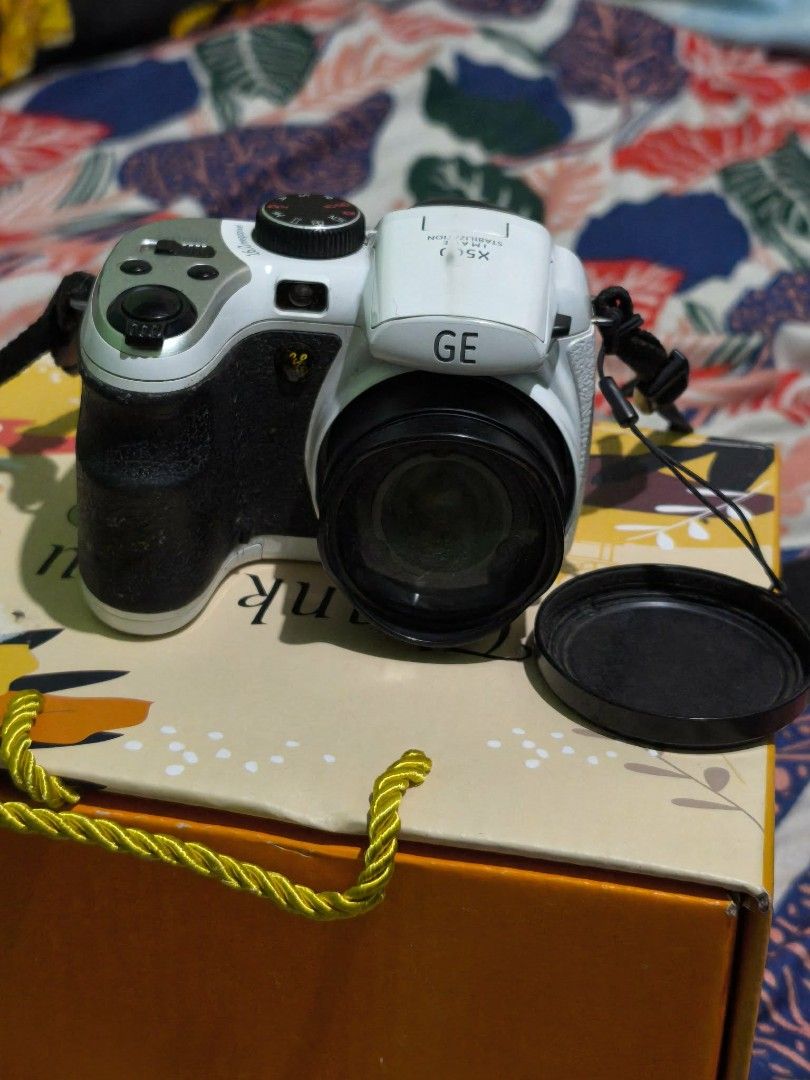 GE X500 Digital Camera (Category: Cameras) located in Quezon City. Submitted by zh_nn (Listing ID 1418201835, Image 2). Description: Specs: • 14 megapixels • 15x optical zoom + 5.7x digital zoom • 2.7" LCD screen • Built-in flash Inclusions: 1. Unit itself (w/ signs of usage) 2. 4pcs AA Alkaline Batteries 3. 16GB Memory Card 4. Camera bag The following have been tested: 1. Flash ✅ 2. Buttons ✅ Issues: • Mode dial is slightly loose but still worki