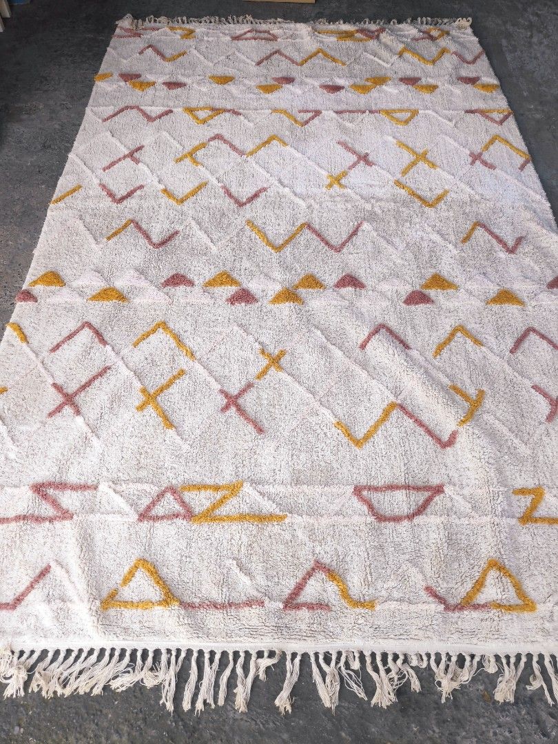 Geometric Pattern Rug (Category: Carpets, Mats & Flooring) located in Plaridel. Submitted by tonilousg (Listing ID 1418207766, Image 2). Description: Lotte Extra Large Carpet Remarks: 🔶 As Is 🔶 Pull Out 🔶 6ft x 9ft -Geometric rug with a vibrant pattern. - Colors: White, yellow, and pink. - Textured surface. - Features fringed edges. - Made of woven material. - Perfect for adding style to your living space. 👉 Check out our MARKETPLACE Listing 
