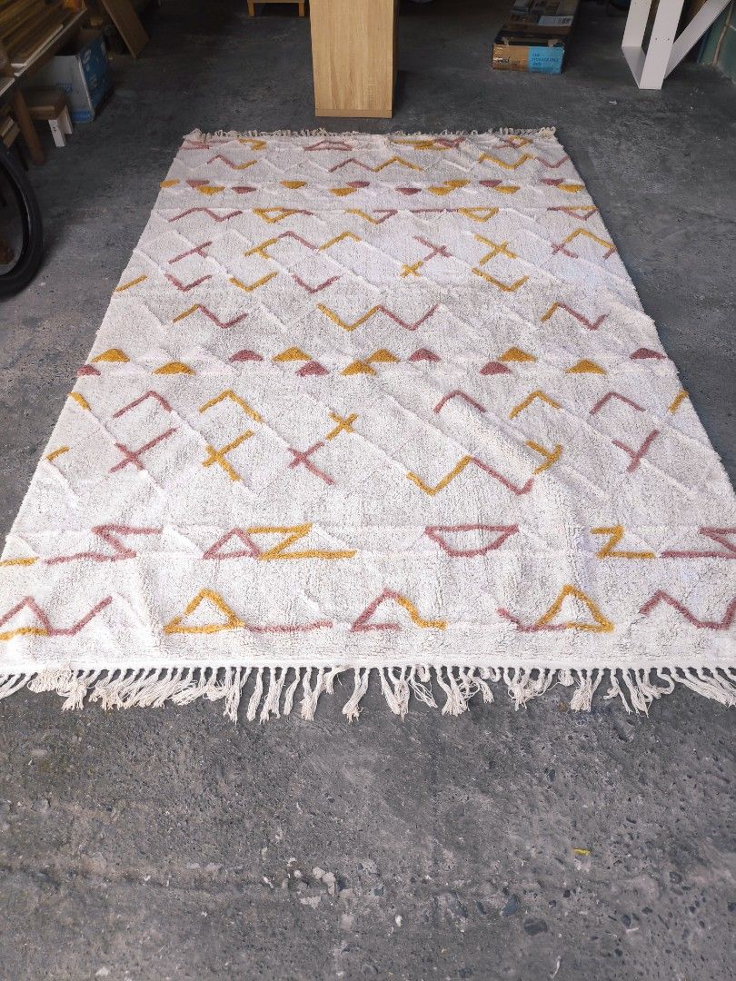 Geometric Pattern Rug (Category: Carpets, Mats & Flooring) located in Plaridel. Submitted by tonilousg (Listing ID 1418207766, Image 1). Description: Lotte Extra Large Carpet Remarks: 🔶 As Is 🔶 Pull Out 🔶 6ft x 9ft -Geometric rug with a vibrant pattern. - Colors: White, yellow, and pink. - Textured surface. - Features fringed edges. - Made of woven material. - Perfect for adding style to your living space. 👉 Check out our MARKETPLACE Listing 