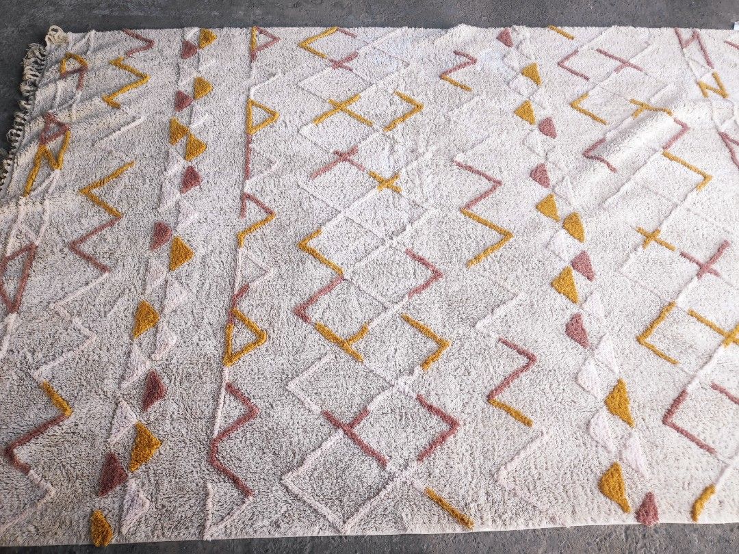 Geometric Pattern Rug (Category: Carpets, Mats & Flooring) located in Plaridel. Submitted by tonilousg (Listing ID 1418207766, Image 3). Description: Lotte Extra Large Carpet Remarks: 🔶 As Is 🔶 Pull Out 🔶 6ft x 9ft -Geometric rug with a vibrant pattern. - Colors: White, yellow, and pink. - Textured surface. - Features fringed edges. - Made of woven material. - Perfect for adding style to your living space. 👉 Check out our MARKETPLACE Listing 