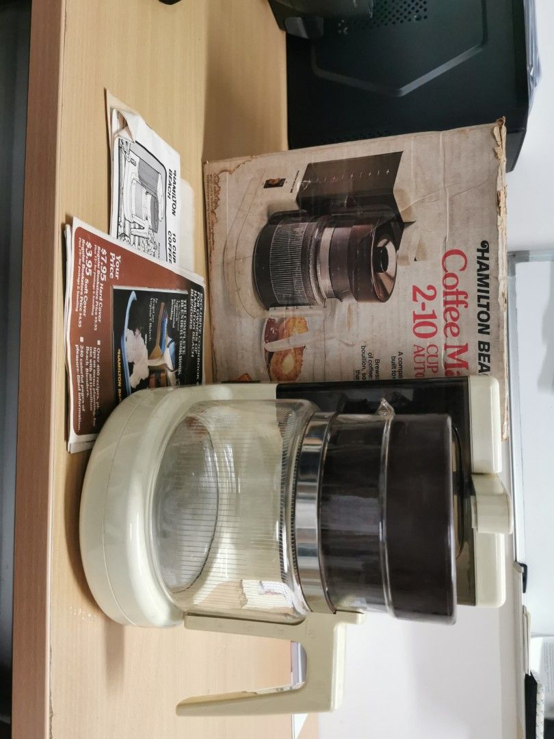 Hamilton Beach 2-10 Cup Coffee Maker (Category: Coffee Machines & Makers) located in Pasig City. Submitted by seller_in_ortigas_ctr (Listing ID 1418101915, Image 1). Description: - Vintage Hamilton Beach coffee maker - Includes original box and manuals - Features a classic design with a glass carafe - Color scheme: Brown and cream -110v Made in USA - Capacity: 2-10 cups. Pristine. No damage. .