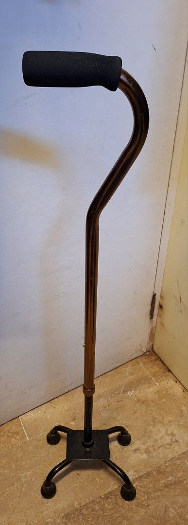 Heavy duty Quad Cane (Category: Medical Supplies & Tools) located in Paranaque City. Submitted by tsentiatsen (Listing ID 1418049977, Image 1). Description: - Provides increased stability with a four-point base. - Comfortable curved handle for a secure grip. - Height-adjustable shaft for a customized fit. - Aids in mobility and balance. - Stylish design with a black base and bronze shaft..