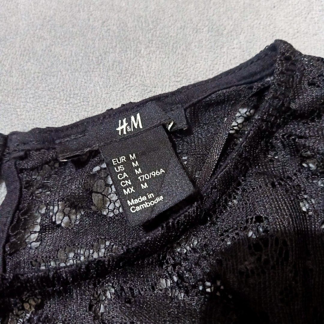H&M Black Lace Top - Size M (Category: Sleeveless) located in San Jose. Submitted by gemhavenxx (Listing ID 1418140903, Image 3). Description: - H&M black top - Lace detailing on upper chest - Short sleeves - Round neckline - Size: M - Made in Cambodia.