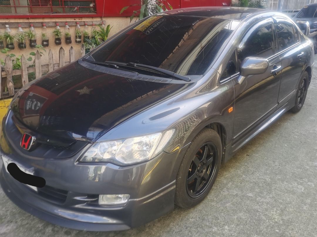 Honda Civic 1.8 VTI-S (A) (Category: Used Cars) located in Manila. Submitted by tabitabz (Listing ID 1418037818, Image 3). Description: Honda Civic FD 1.8S 2006 Model A/T Plate ending number : 9 (Friday coding), LTO registered till 2026 Never flooded, regularly maintained and cleaned. Mileage- 105k+, used as spare/coding unit, auto sweep RFID installed Changed radio unit to Nakamichi screen type head unit. Leathered seats and side panels. Rays br