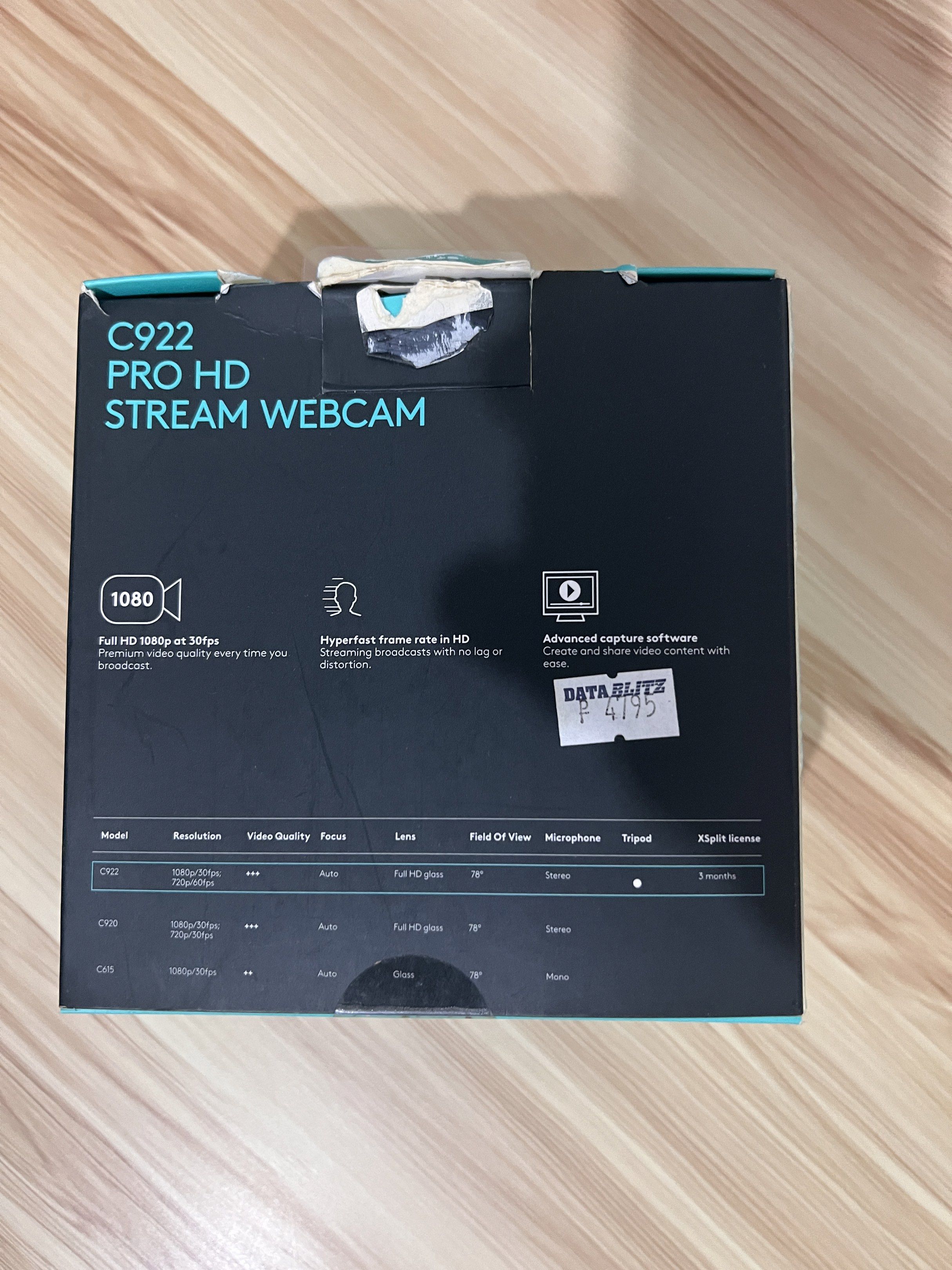 Logitech C922 Pro HD Stream Webcam (Category: Webcams) located in Mandaluyong City. Submitted by elena_kk (Listing ID 1418206203, Image 3). Description: Logitech C922 Pro HD Stream Webcam. Features full HD 1080p at 30fps and 720p at 60fps. Includes a built-in microphone and advanced capture software. The box indicates a tripod and Xsplit license. Perfect for streaming and video calls..