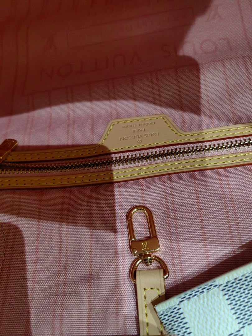 Louis Vuitton Damier Azur Neverfull MM (Category: Luxury Bags & Wallets) located in Cebu City. Submitted by erlacoleccion (Listing ID 1418183463, Image 3). Description: - Japan Surplus Louis Vuitton Neverfull MM handbag -Authentic leather specs - Damier Azur canvas - Includes matching pouch and dust bag - Features the iconic checkered pattern - Light beige leather trim and handles - Stylish and practical tote bag.